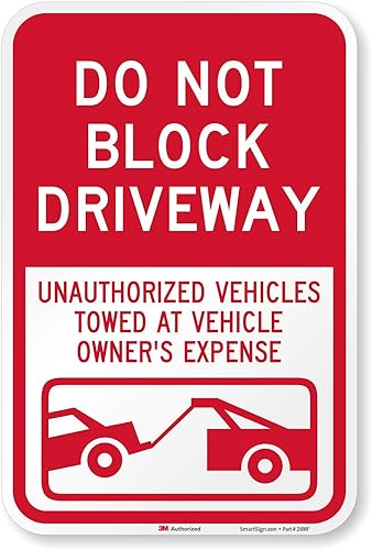 Miniatura 1 de SmartSign calcomanía de letrero para estacionamiento "Do Not Block Driveway - Vehicle Towed" con gráfico, color rojo sobre blanco, idioma español no