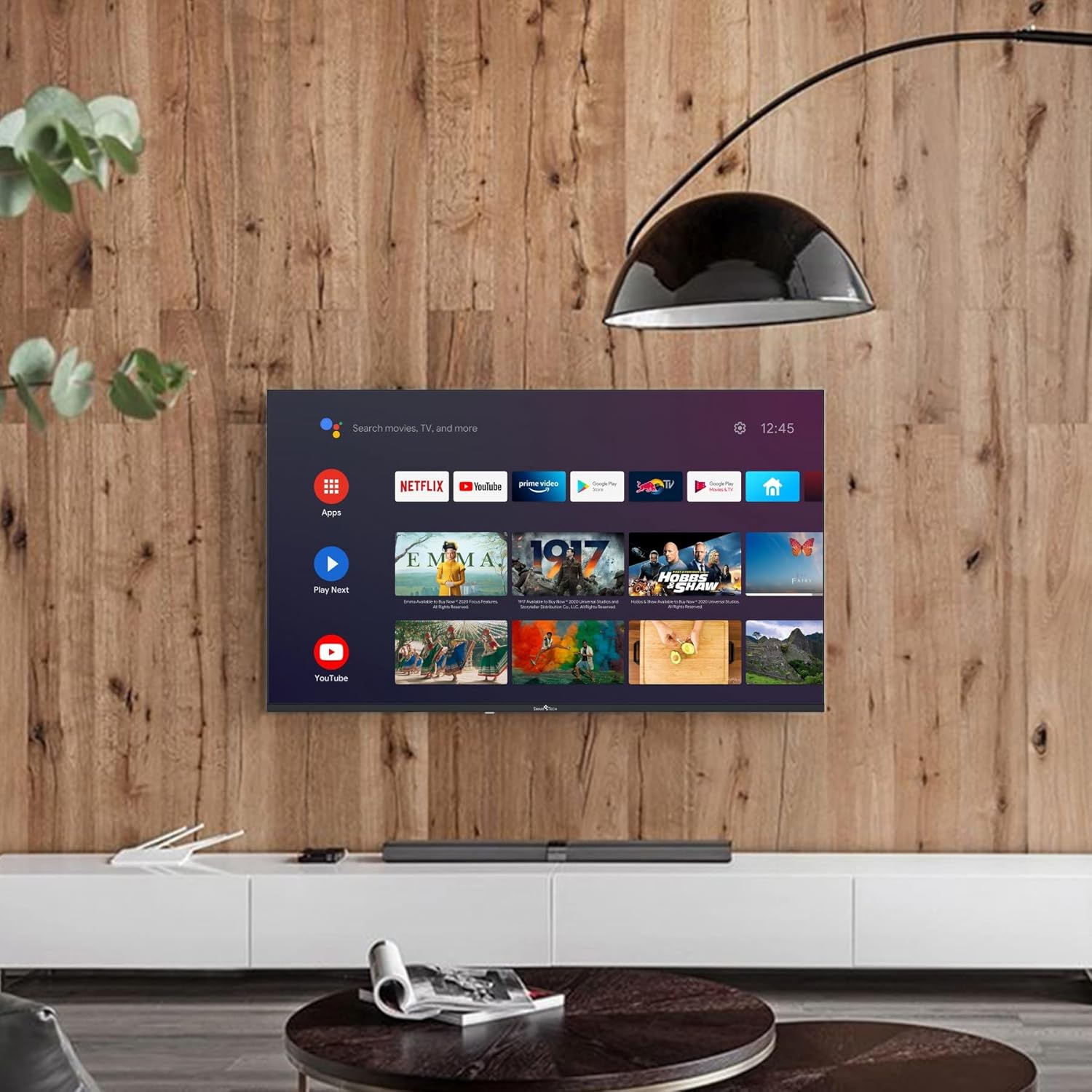 Smart Tech 50UA10V3 TV mounted on a wooden wall in a living room