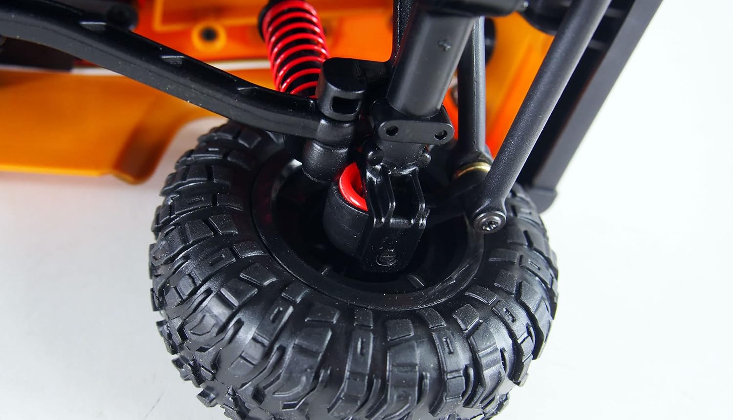 Close-up of the front suspension and wheel assembly of the Amewi D90X12 Landrover Scale Crawler.