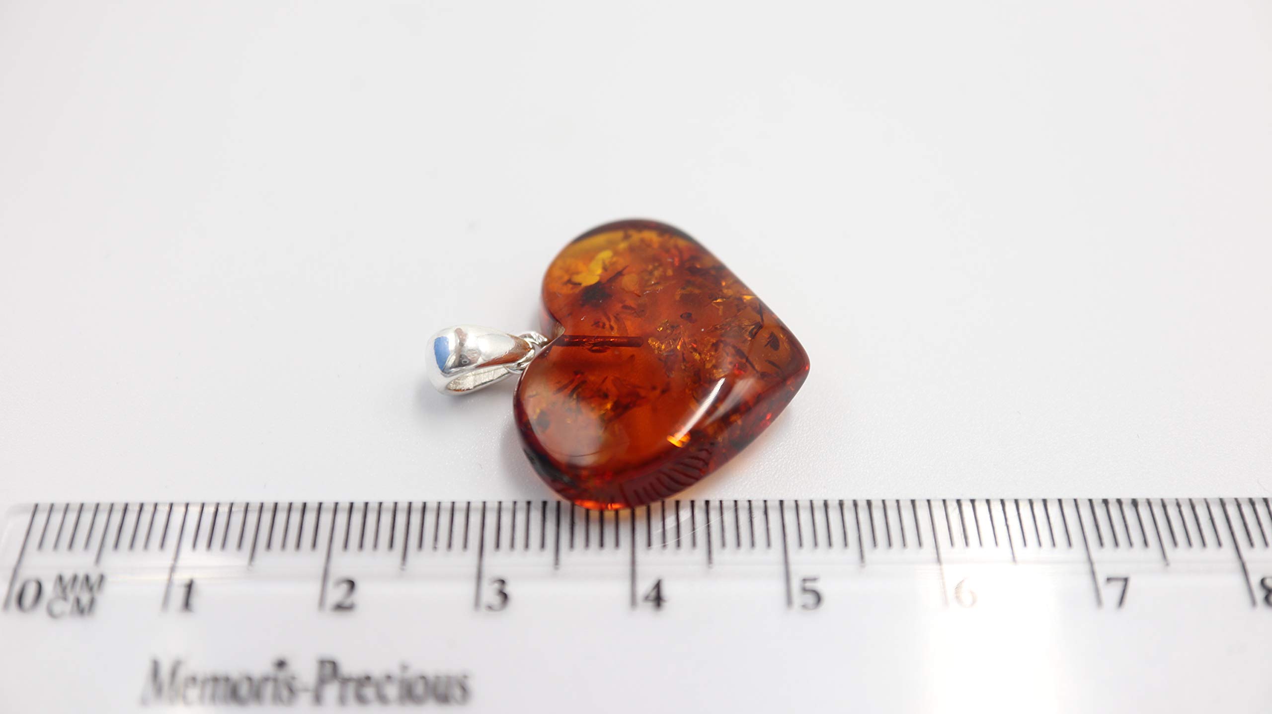 Ciondolo a forma di cuore in ambra baltica color cognac, con fiocco in argento Sterling 925