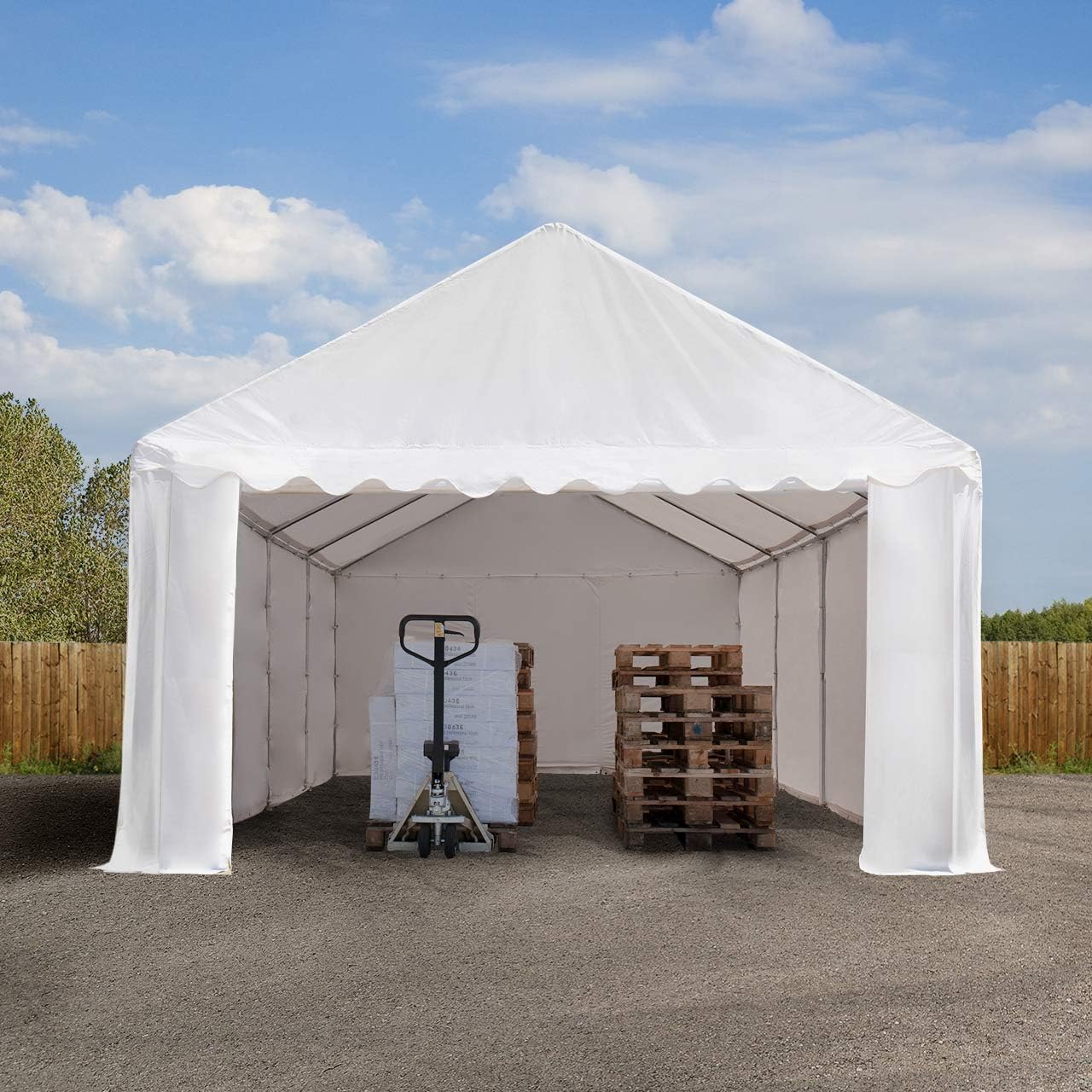 Фронт view of a white storage tent with open entrance, showing pallets inside