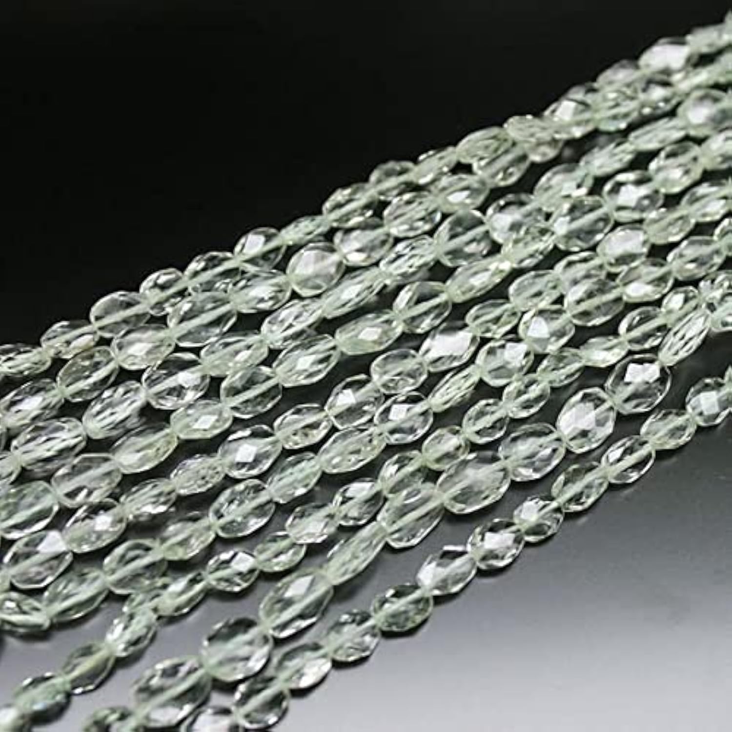 Prasiolite naturelle en perles ovales facettées pour création joaillerie haut de gamme