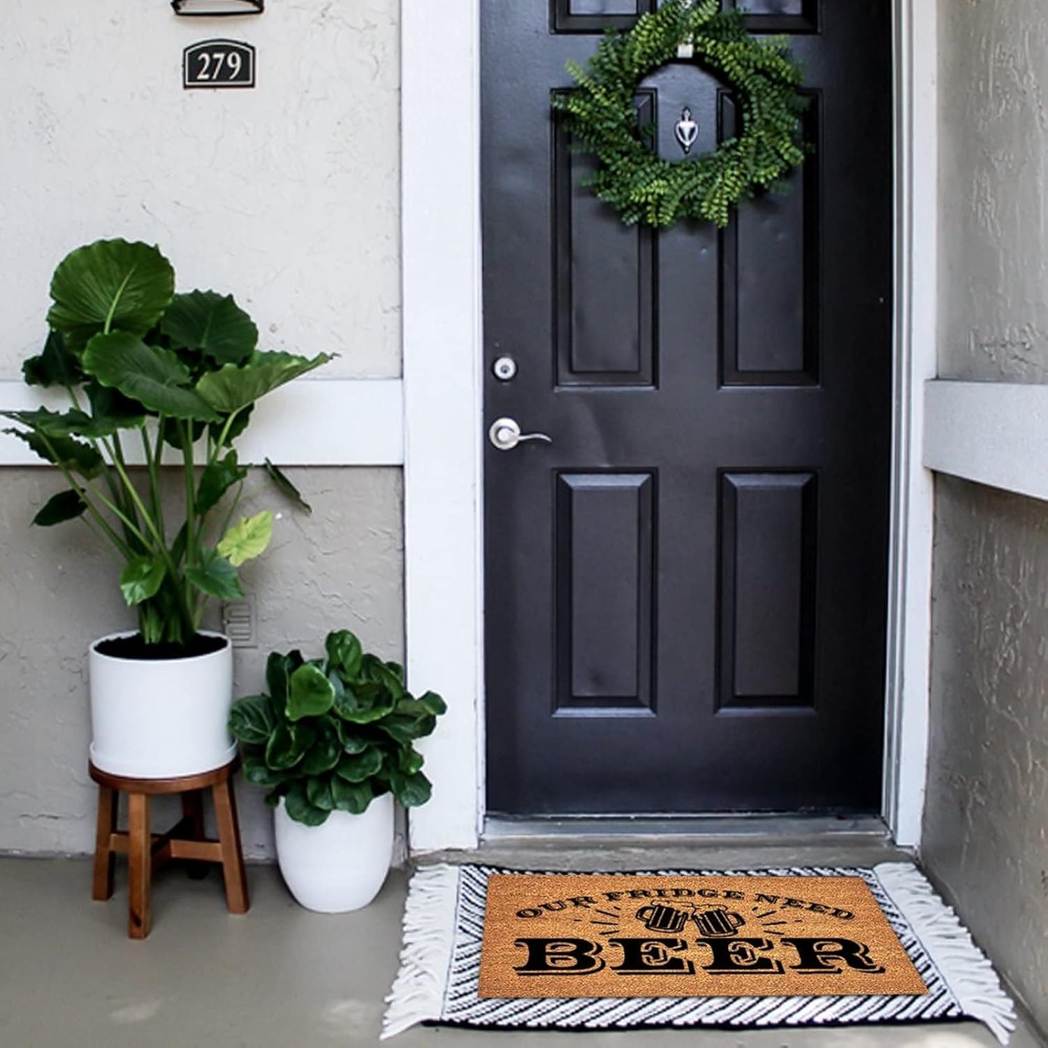 A welcoming porch with a humorous doormat