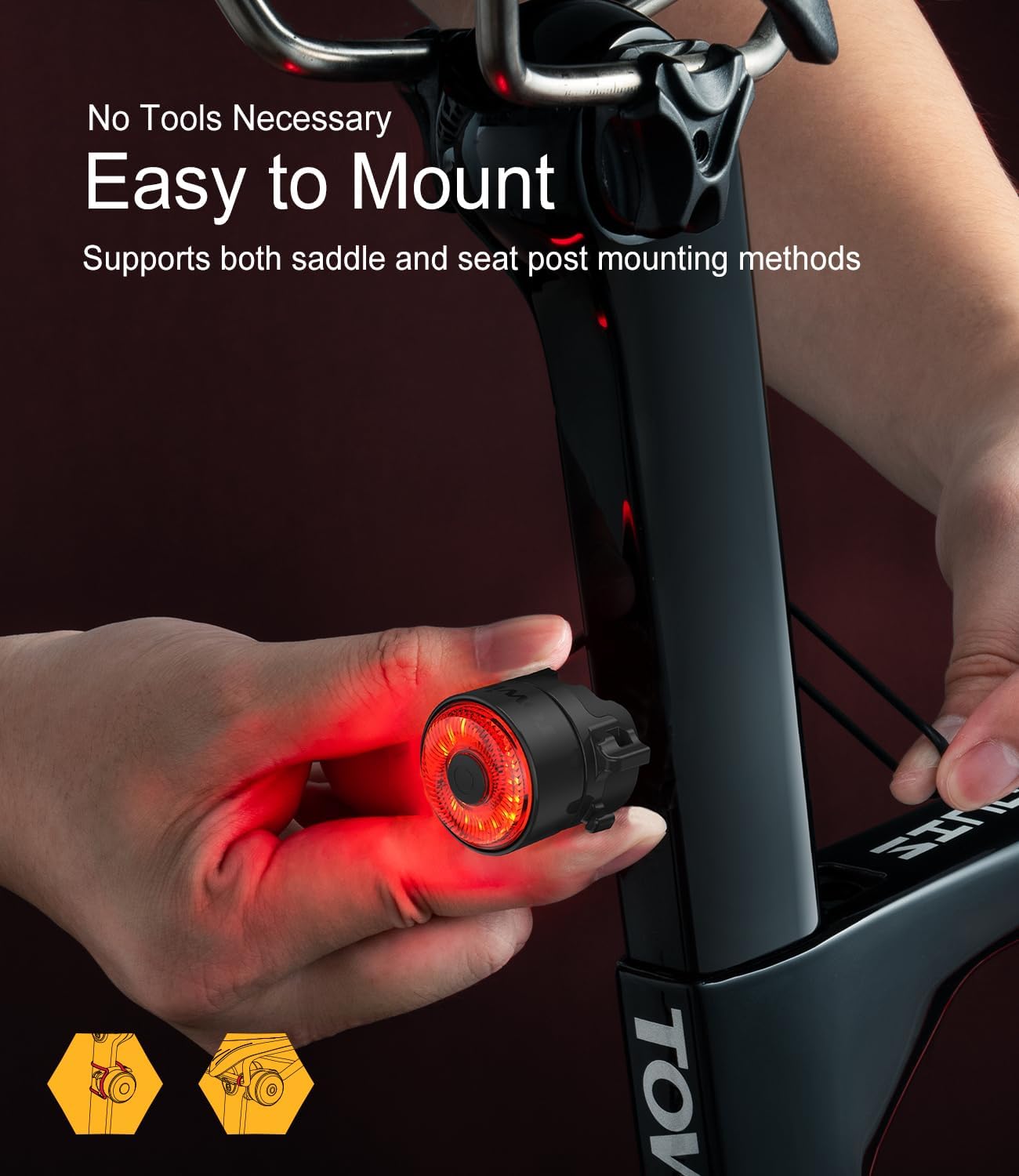 A hand installing the TOWILD TL03 bike tail light onto a bicycle seatpost using the quarter-lock mounting system, showing both saddle and seatpost mounting options.