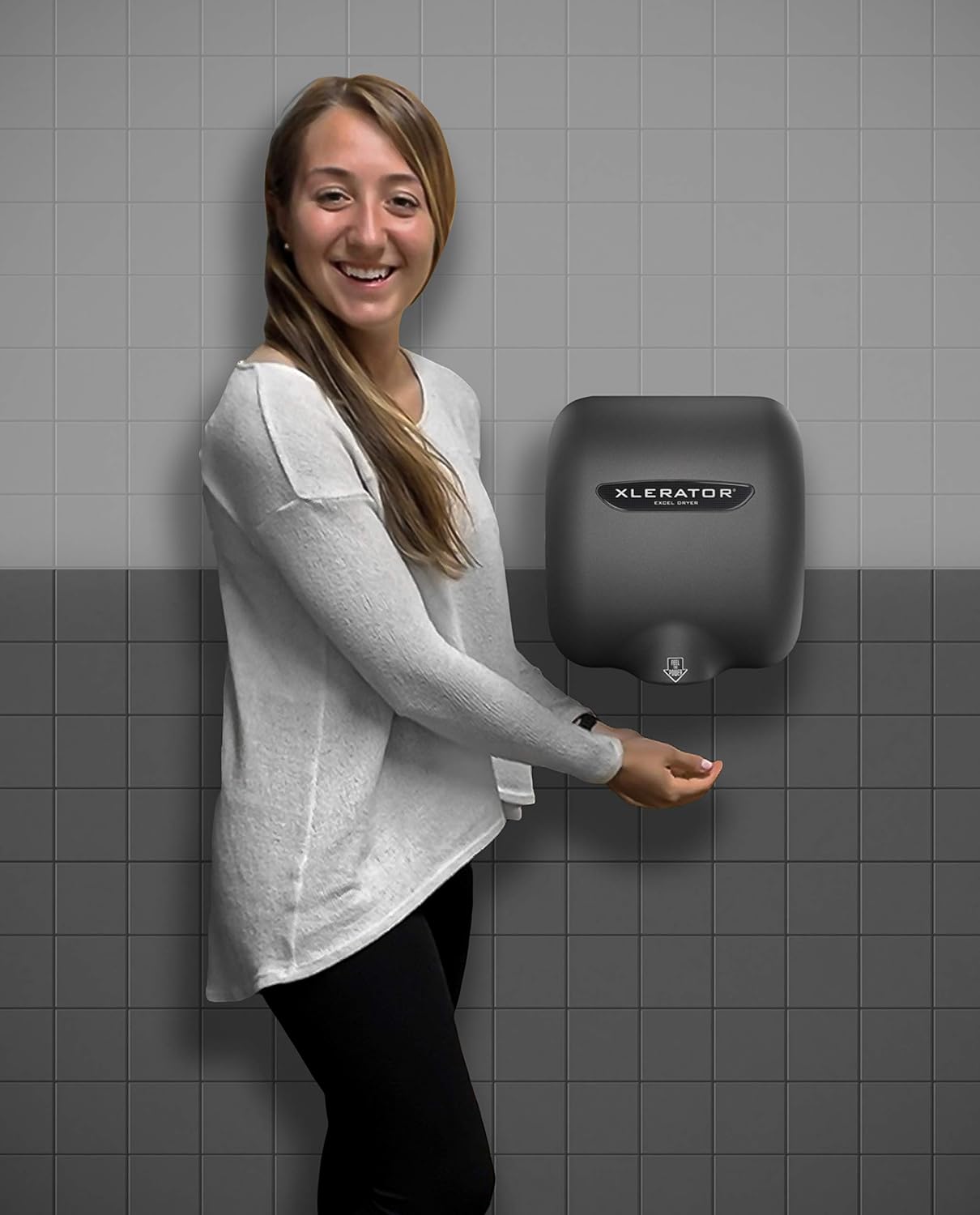 User demonstrating hand drying with XLERATOR hand dryer