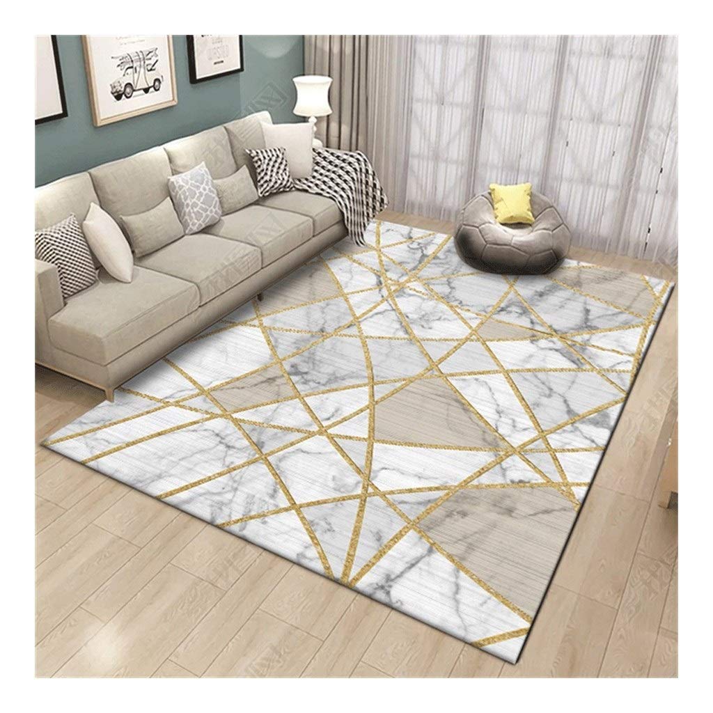 Tapis moderne géométrique doré pour un grand salon chaleureux et cocooning