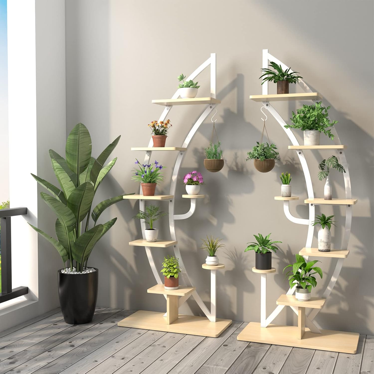 Two half-moon plant stands combined to form a full circular display, filled with plants.