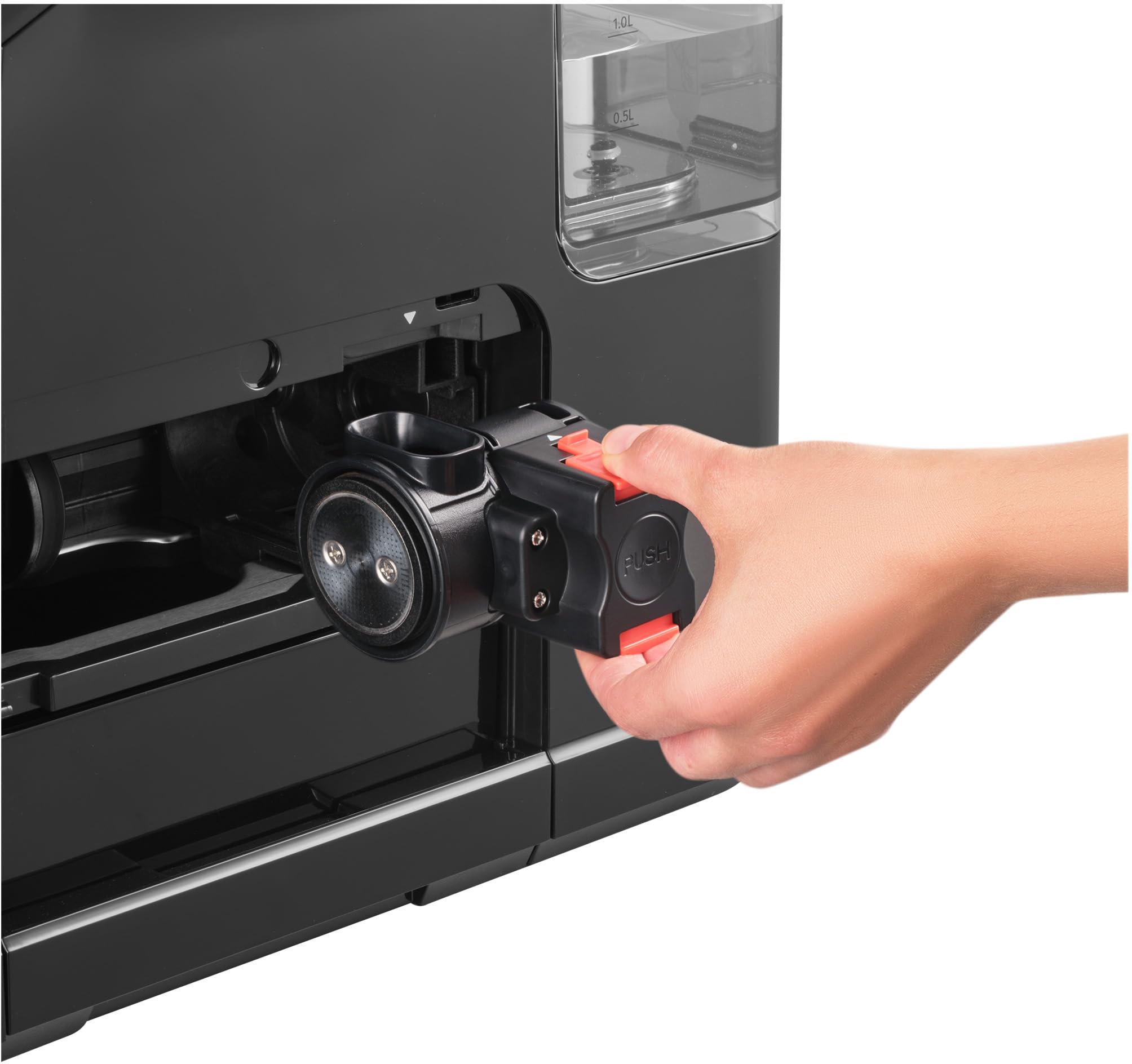 Hand removing the brewing unit from the SENCOR SES 6000BK espresso machine