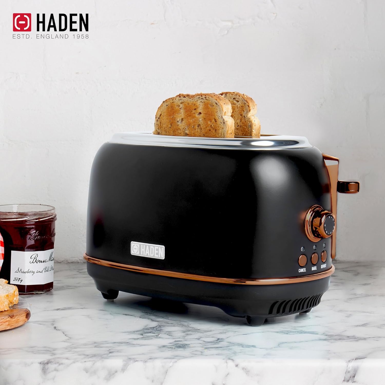 Haden Heritage 2-Slice Toaster with bread in slots and control panel visible.