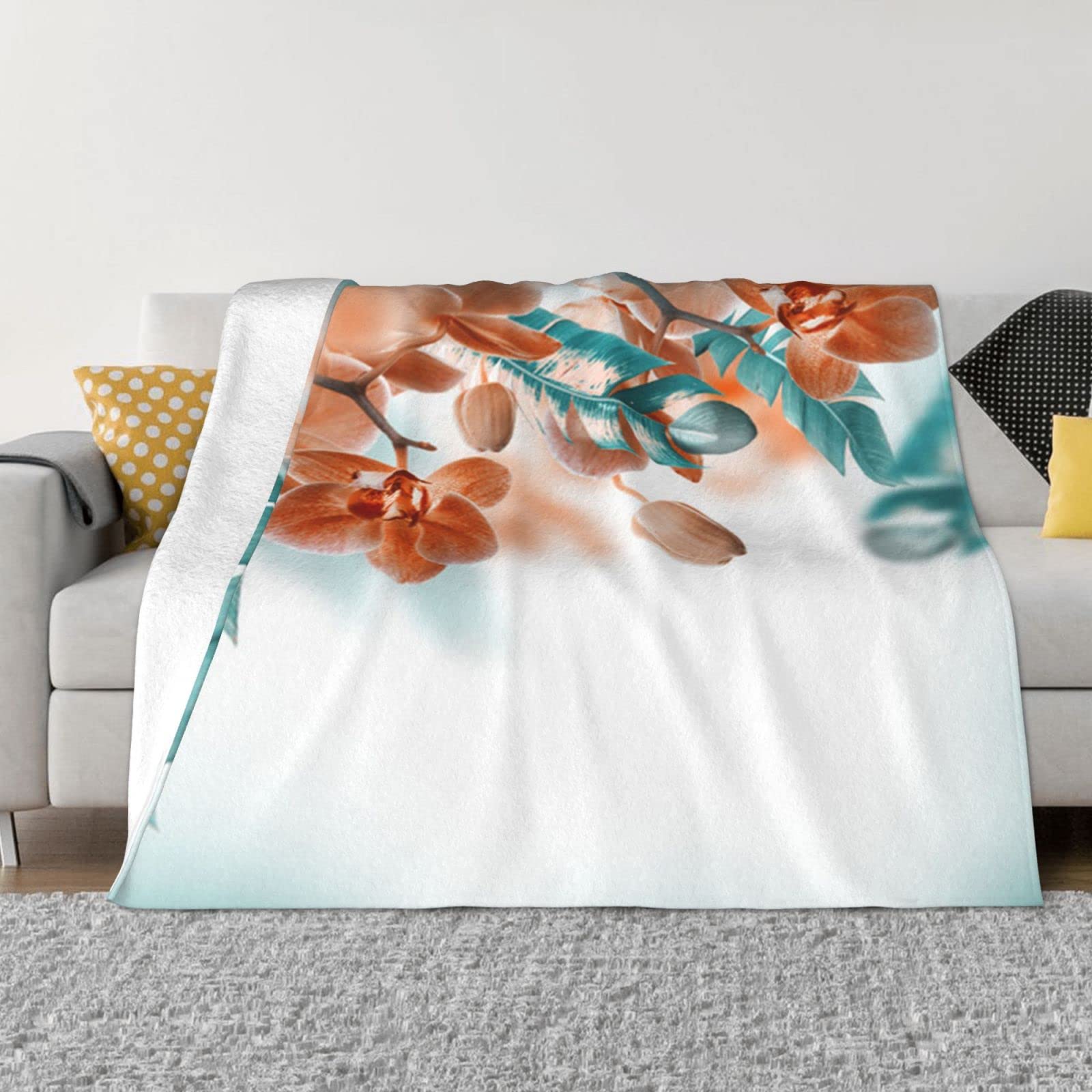 Couverture polaire canapé pour cocooning hivernal bleu et orange