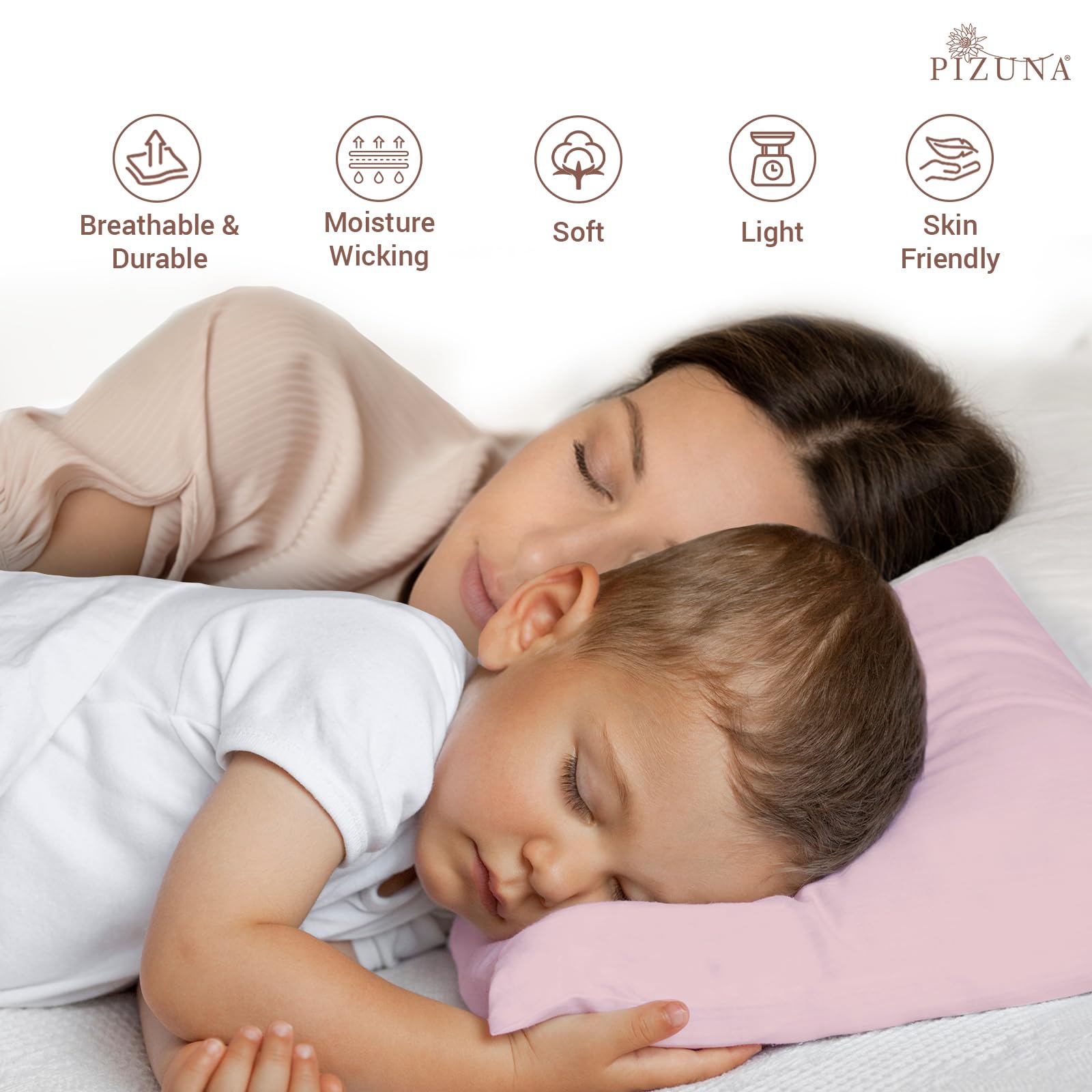 A close-up view of the Pizuna toddler pillowcase showcasing its soft sateen weave and light pink colour.
