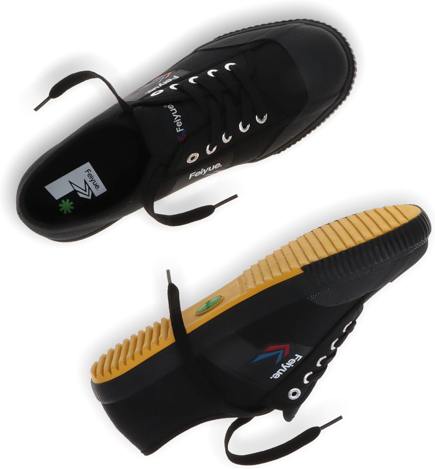 FEIYUE Fe Lo 1920 black shoe on a rock by the ocean