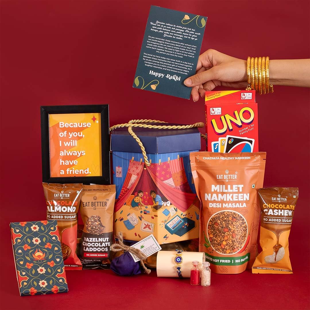 EAT BETTER CO Yaadon Ka Dabba 10-Item Rakhi Gift Hamper Evil Eye Rakhi, Chocolate Coated Almonds, Hazelnut Dry-Fruit Laddoos, Uno & More |for Brother Rakhi Gift Combo Set (B0C7VD7474) Amazon Price History, Amazon Price Tracker