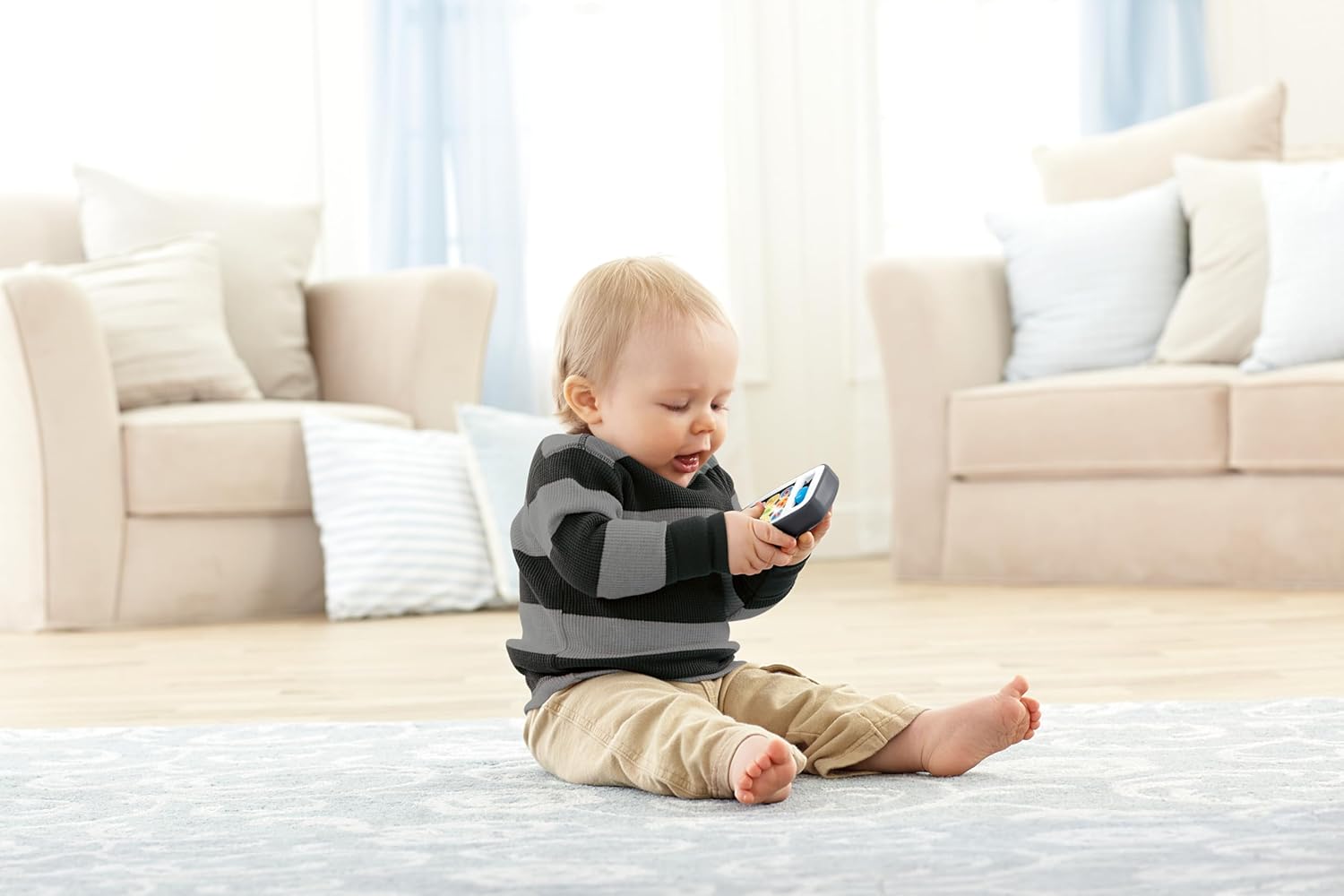 Front view of the Fisher-Price HXB89 Smartphone toy, showing the interactive screen with app icons and a slider switch.