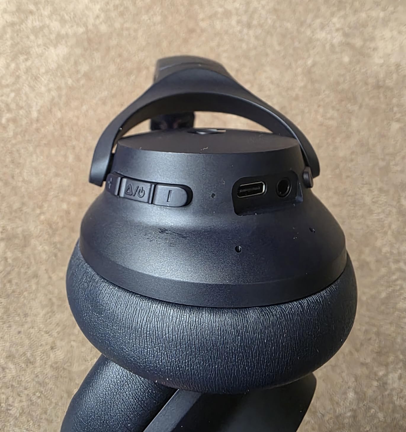 Close-up of the Soundcore Q20i control buttons