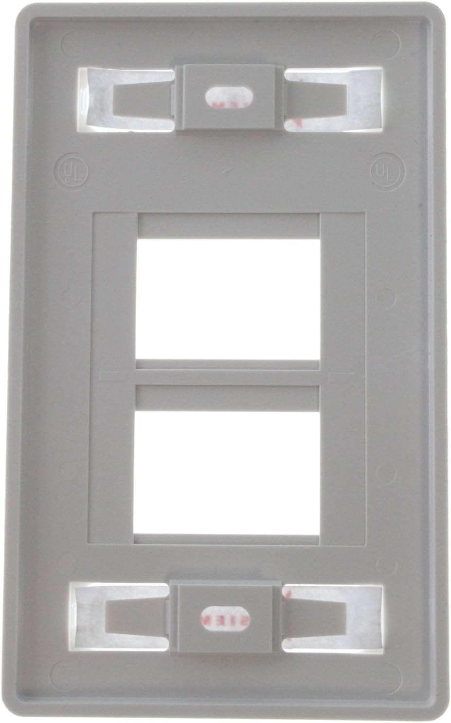 กลับ view of the Siemon MX-FP-S-04-02 faceplate showing mounting screw holes and module retention clips.