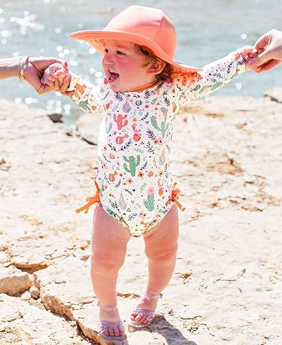 Vista 2 de RuffleButts - Traje de baño de manga larga, de una pieza, para bebéniñas, con protección solar UPF 50+, con cremallera, Cobertura total, 18-24 meses