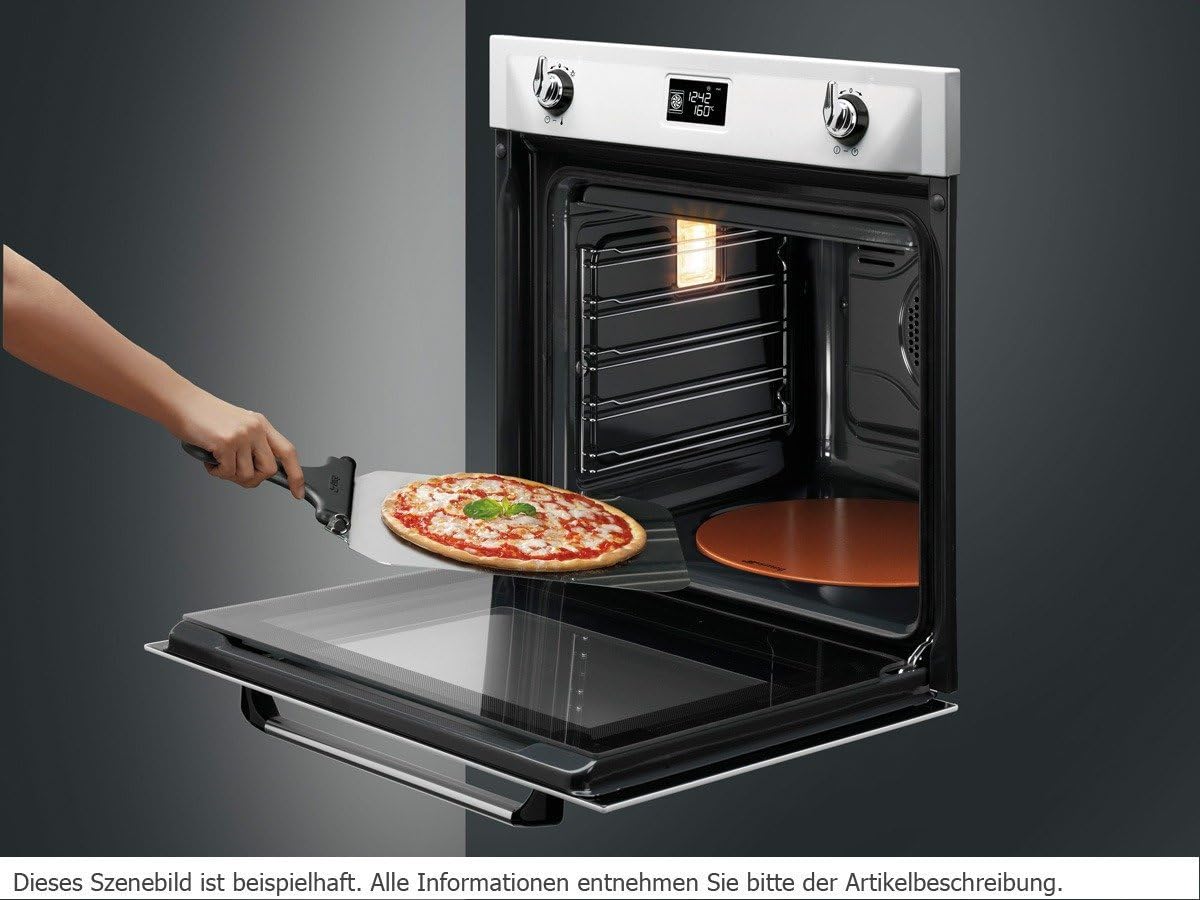 Pizza being inserted into Smeg SF6922NPZ oven with a pizza peel