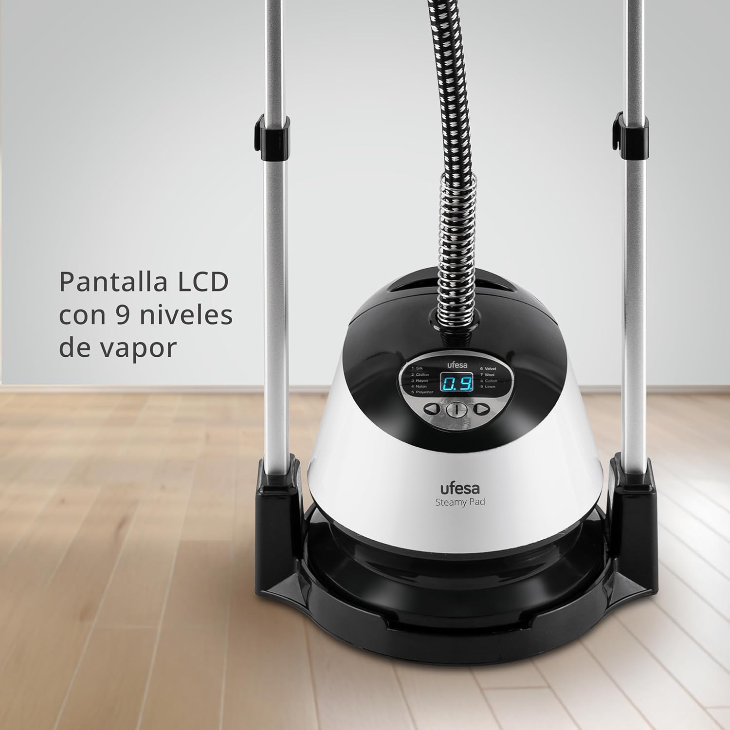 Close-up of the Ufesa Steamy Pad's control panel with an LCD screen displaying '0.9' and steam level buttons.