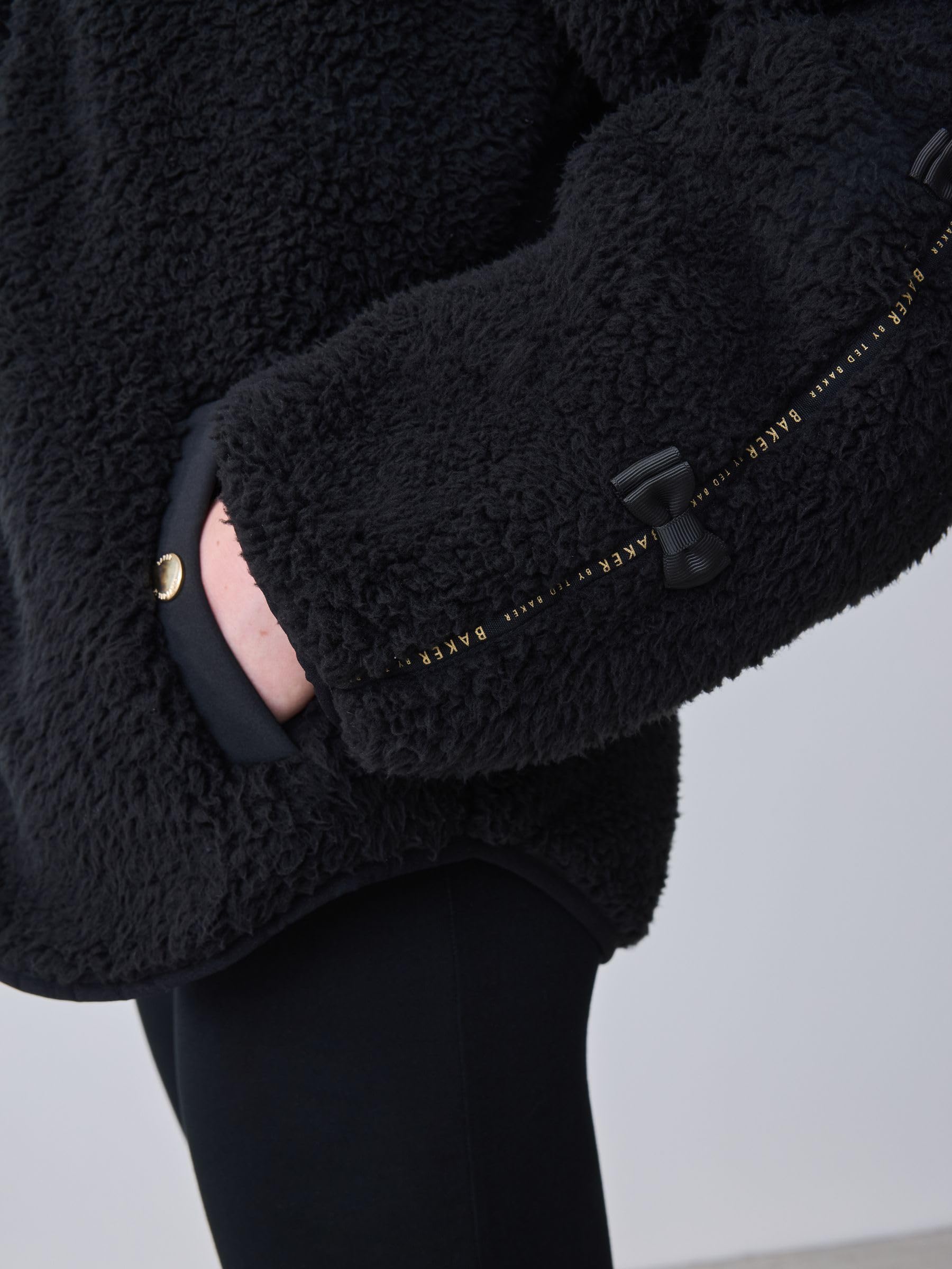 Niñas Polar negro con capucha, cremallera y lazo