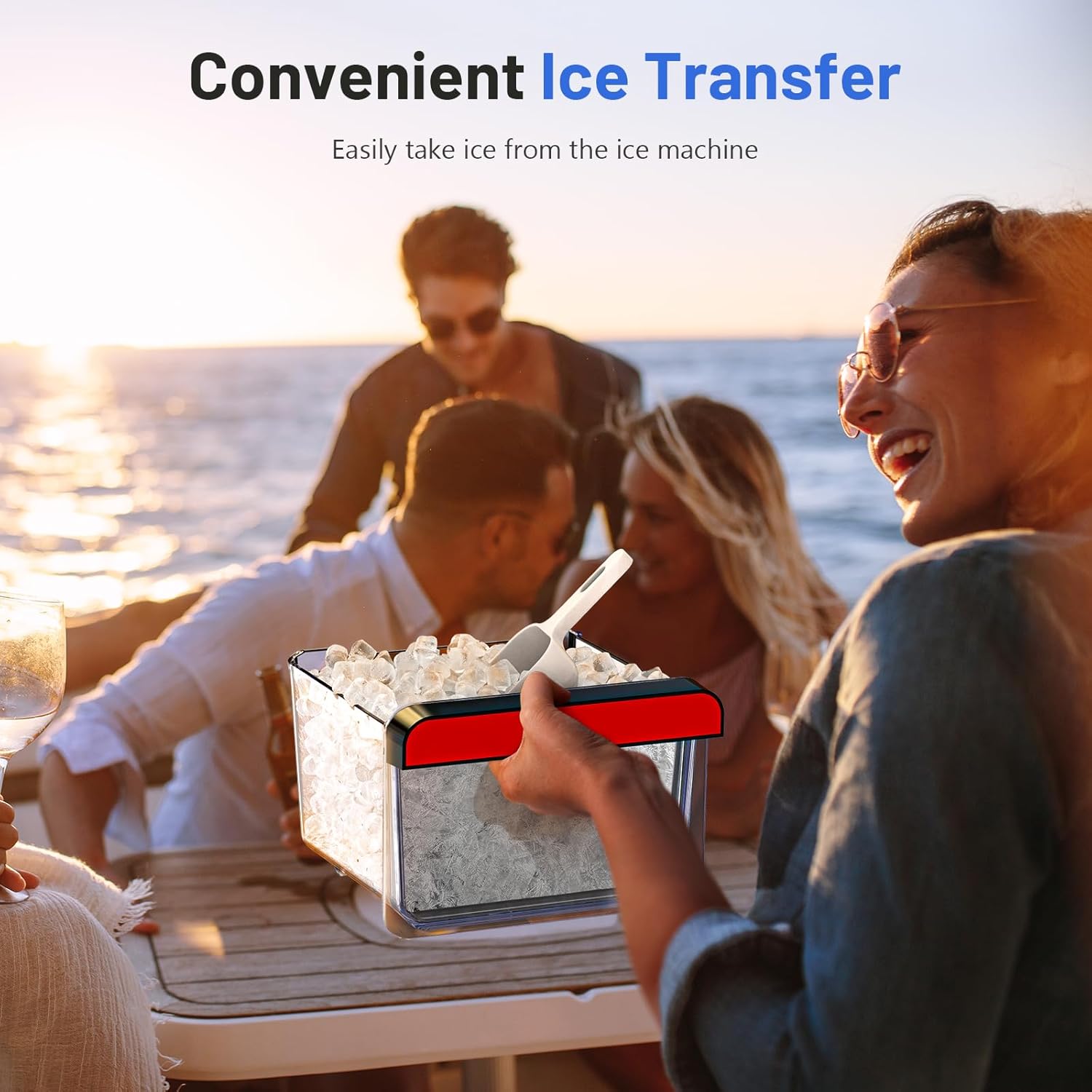 A person easily transferring ice from the ice maker's removable basket using an ice scoop, with other people in the background.