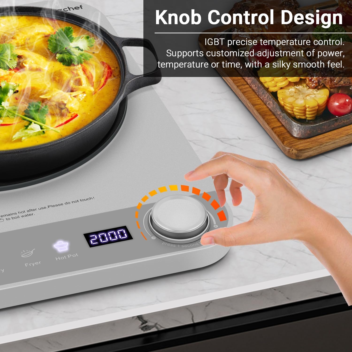 Hand adjusting the electronic knob control on the AMZCHEF Induction Cooktop