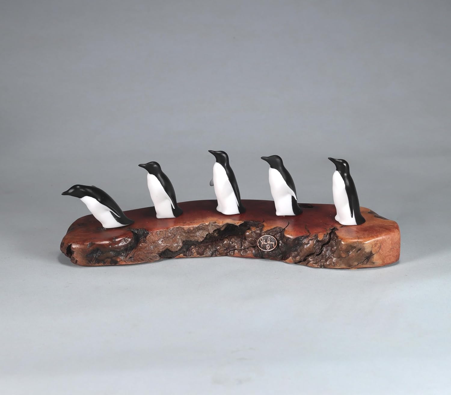 Penguin Flock of 5 Sculpture by John Perry11 inches Long on Polished burlwood Base. Signed.