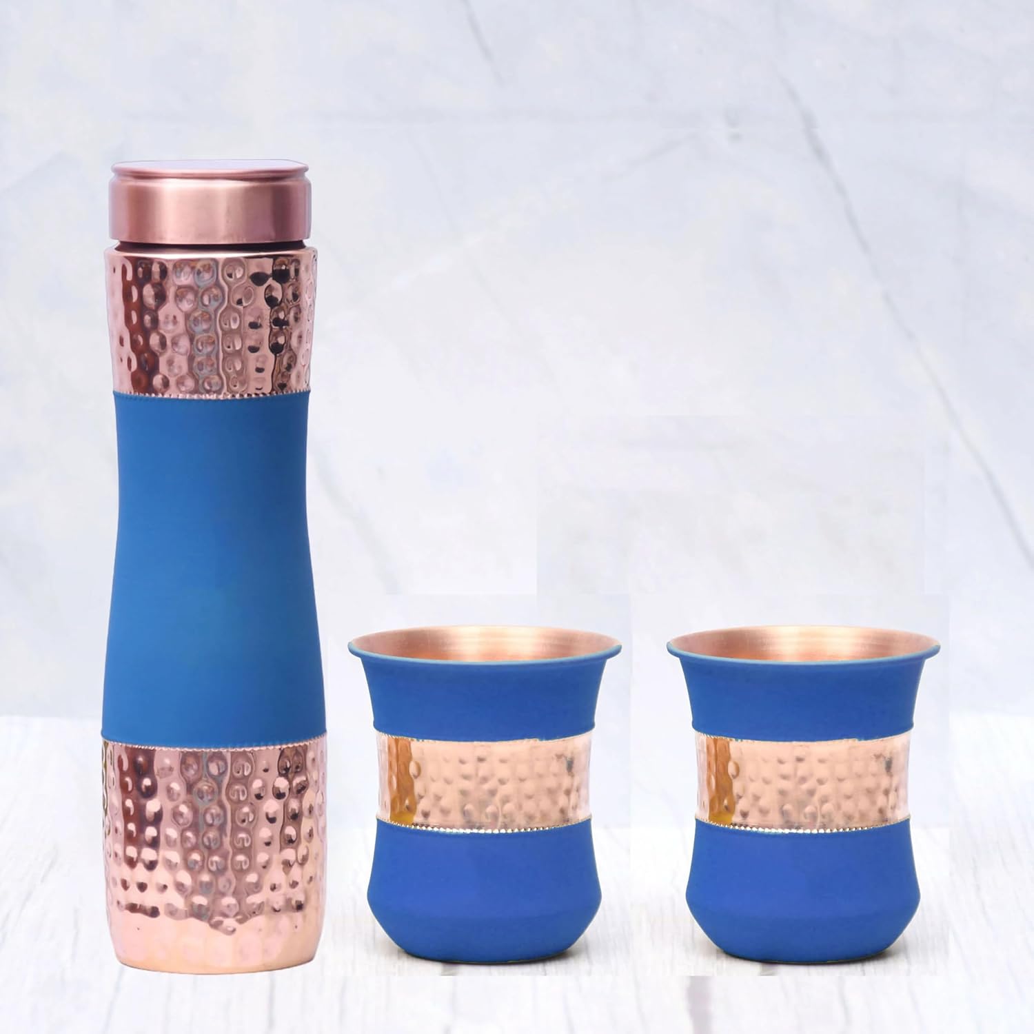 Pure Copper Water Bottle Silk Blue Half Hammered with 2 Dholak Glasses (Set of 3) Capacity 1450 ML Silk Blue Copper Bottle:- 2.83x10.6 inch Glass:-8x8x10.5 CM