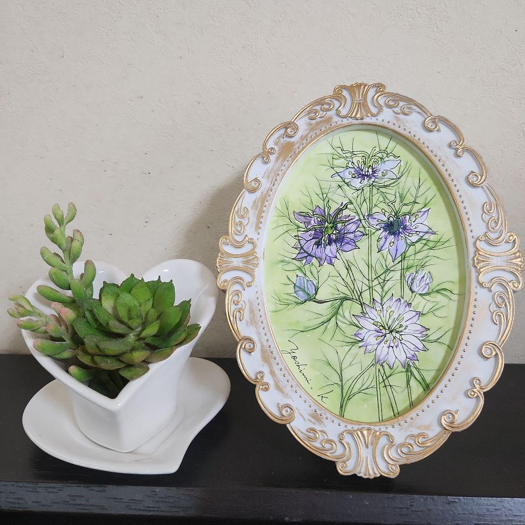 楕円形フレーム入り水彩画2点