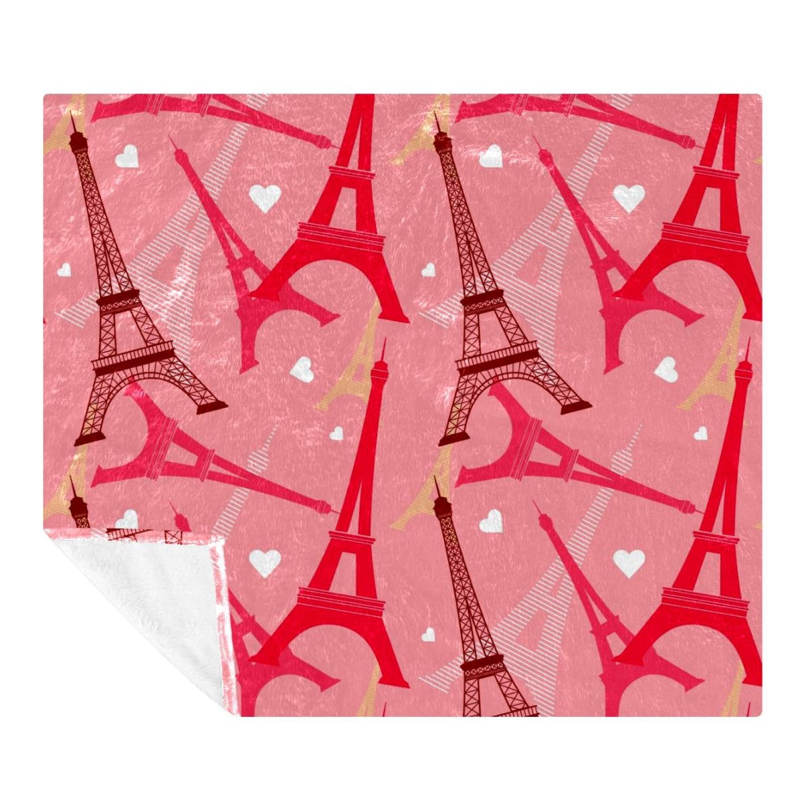 Couverture tour Eiffel douce pour soirées cocooning sur canapé