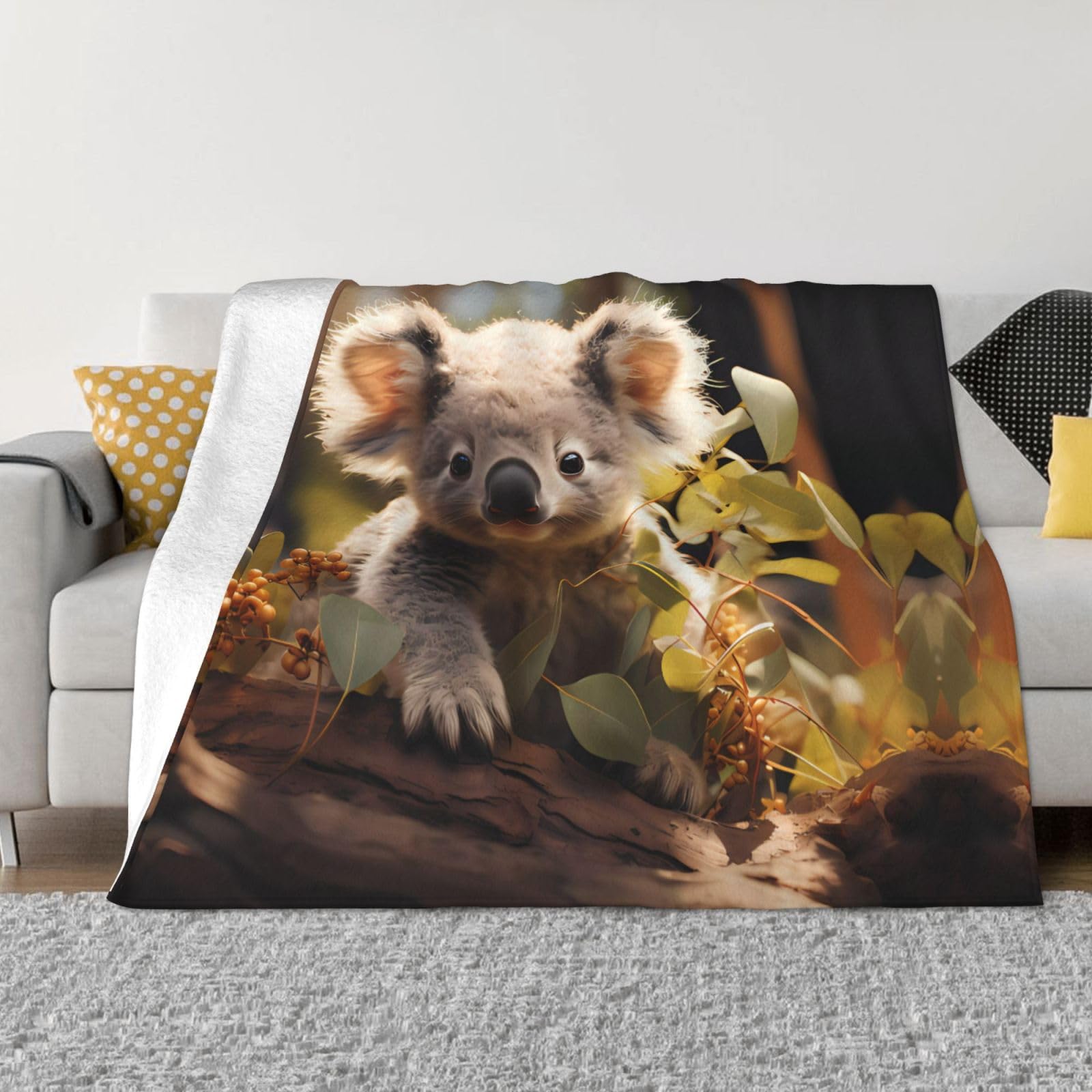Couverture flanelle koala contre le froid sur canapé et camping