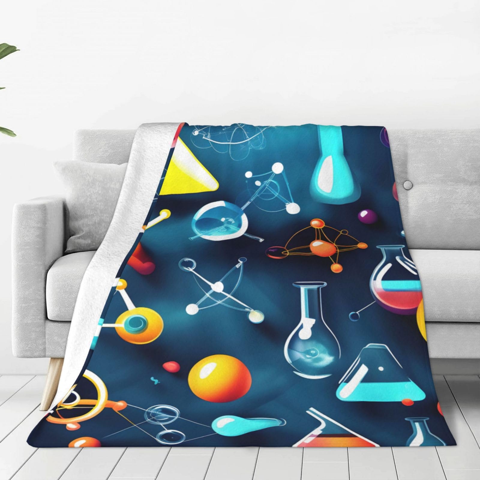 Couverture polaire douce chimie pour vos soirées lecture cocooning sur le canapé