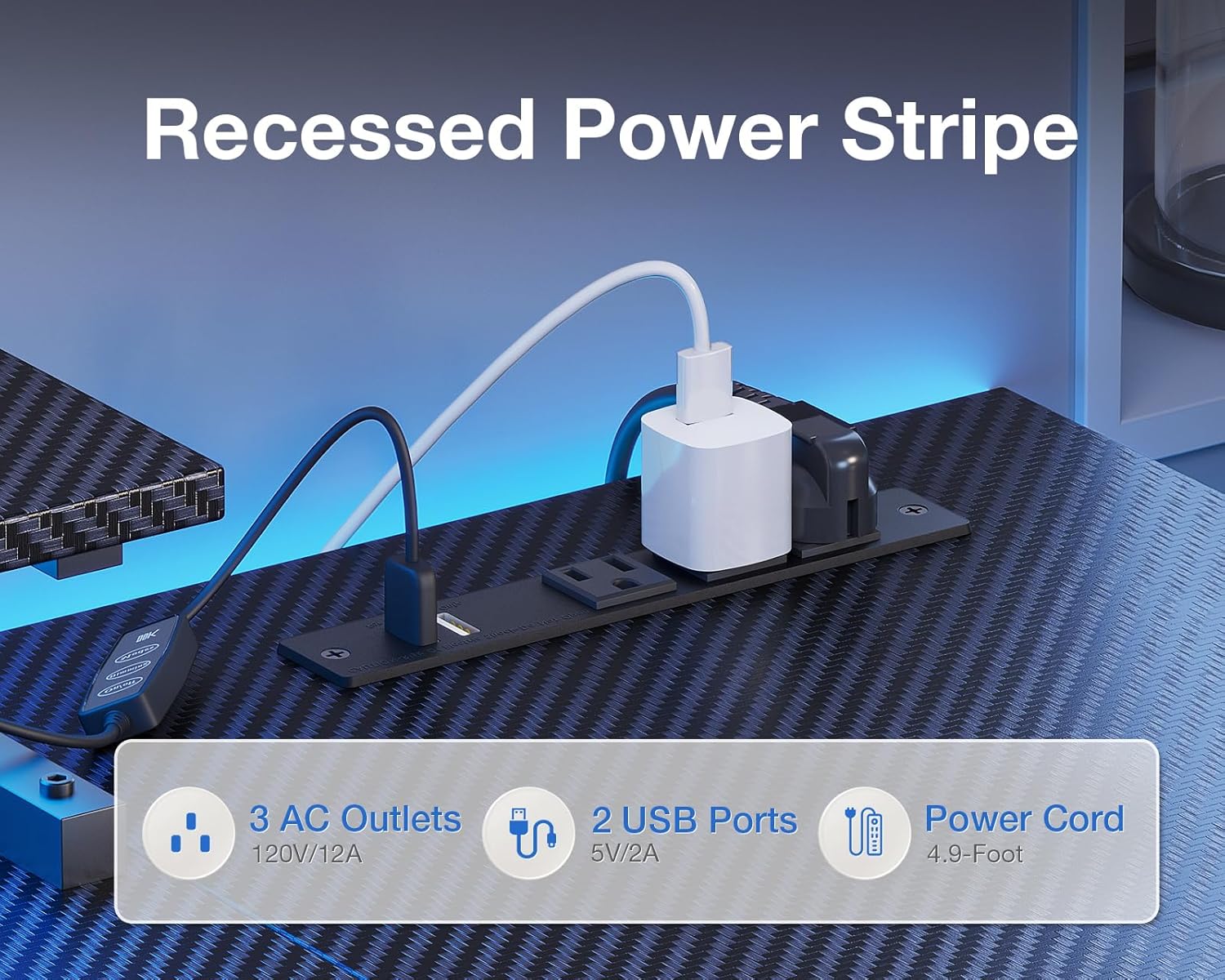 Close-up of the recessed power strip with USB charging ports and AC outlets.