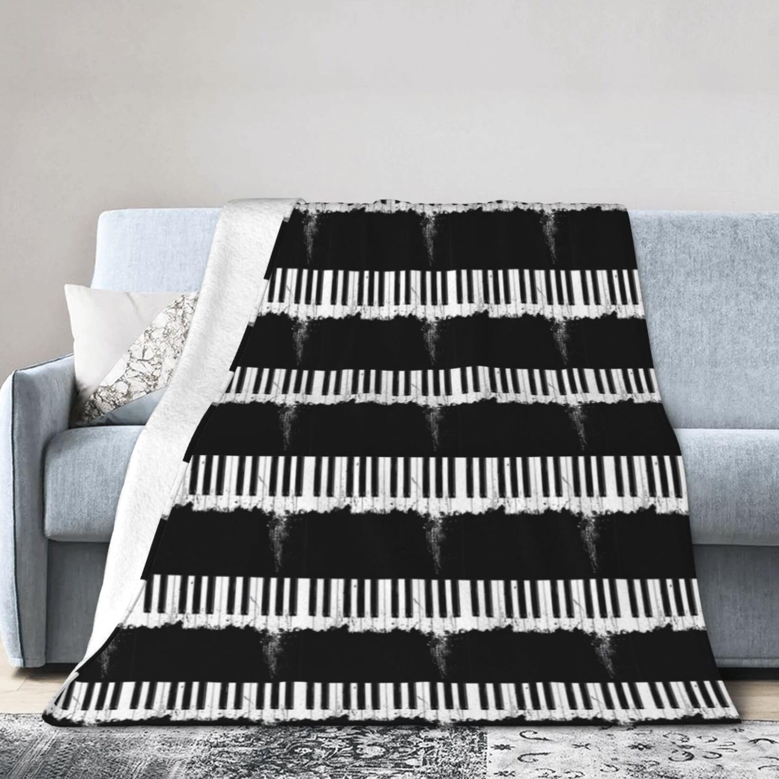 Couverture flanelle motif piano : le cadeau léger parfait pour lit