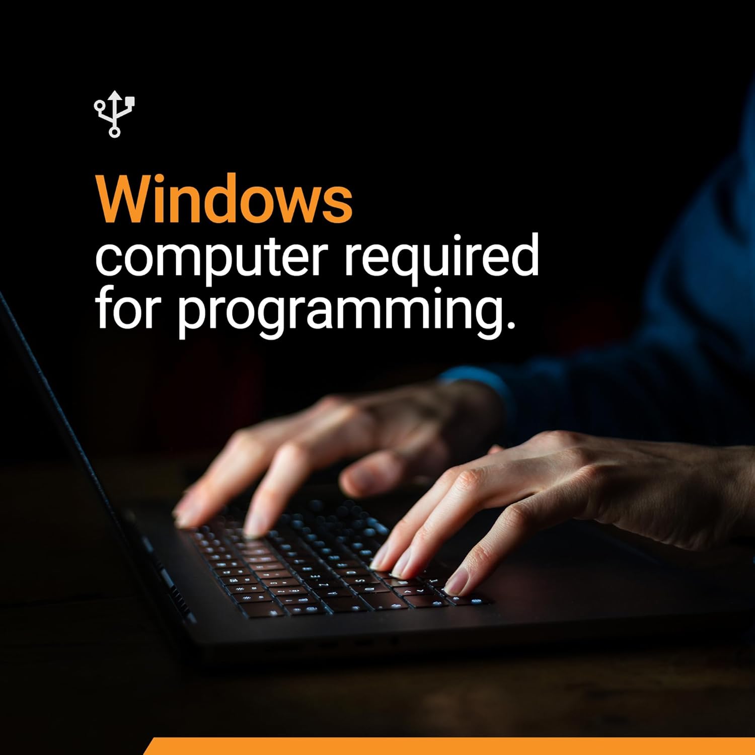 Hands typing on a laptop keyboard, indicating the need for a Windows computer for programming the remote start module.