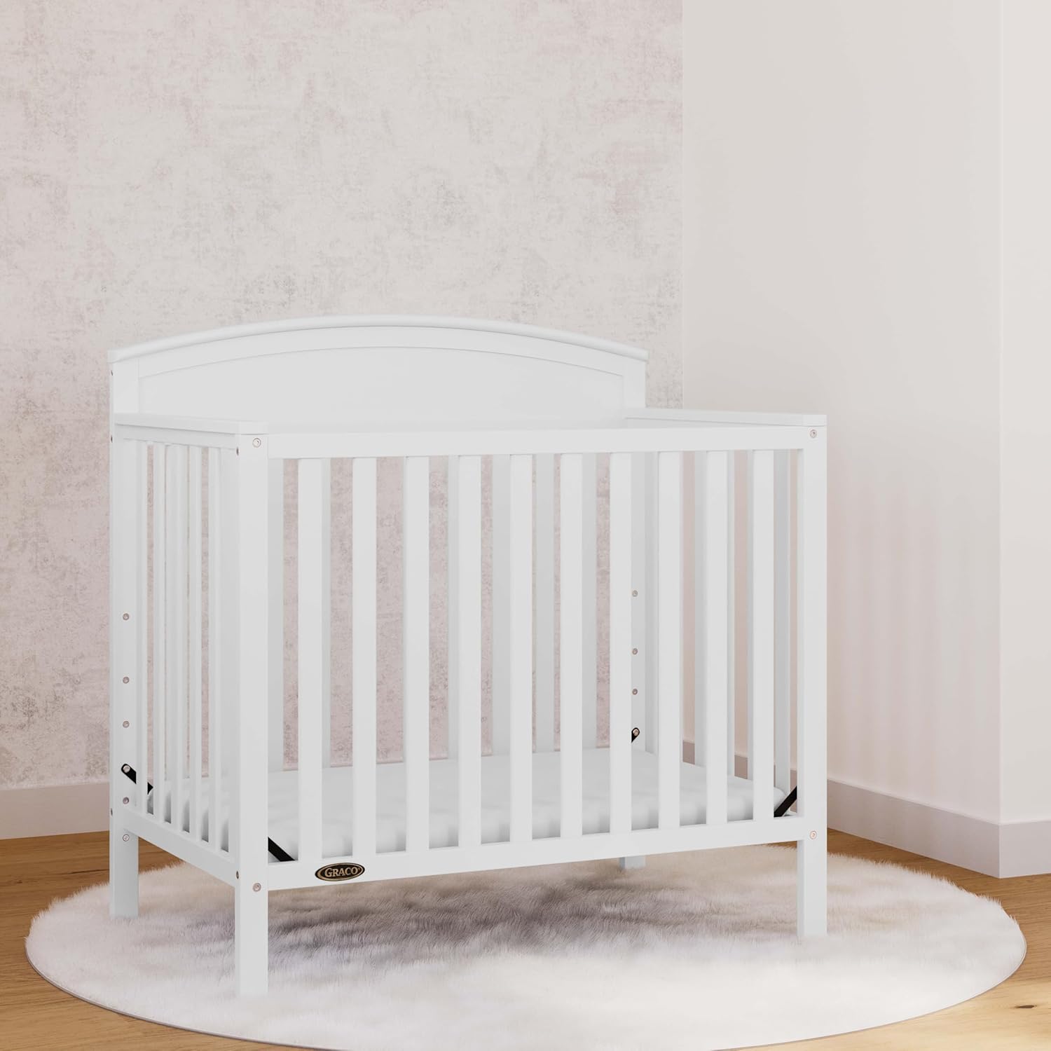 Graco Benton 4-in-1 Convertible Mini Crib with Bonus Crib Mattress – GREENGUARD Gold Certified, 2.75-Inch Mattress Included, Baby Crib Converts to Twin Bed, Ideal for Small Spaces (White)