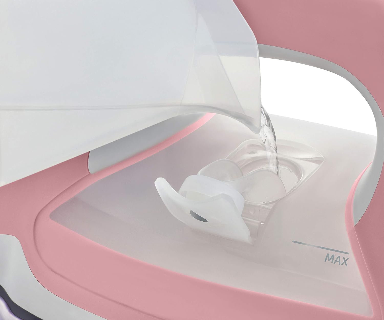 Hand pouring water into the side-fill tank of the Oliso TG1600 Smart Iron
