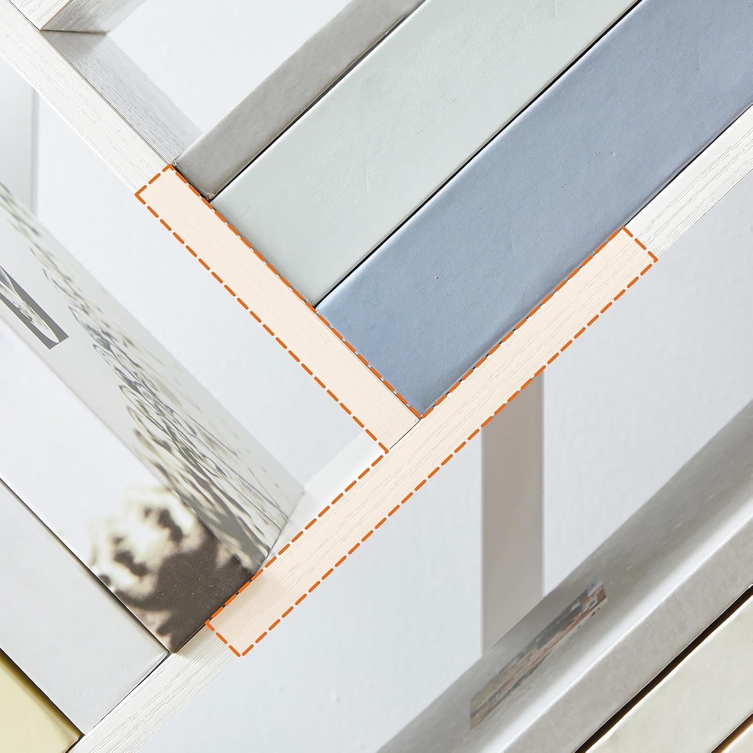 Close-up of the bookshelf's T-shaped shelf design, showing how books are supported.