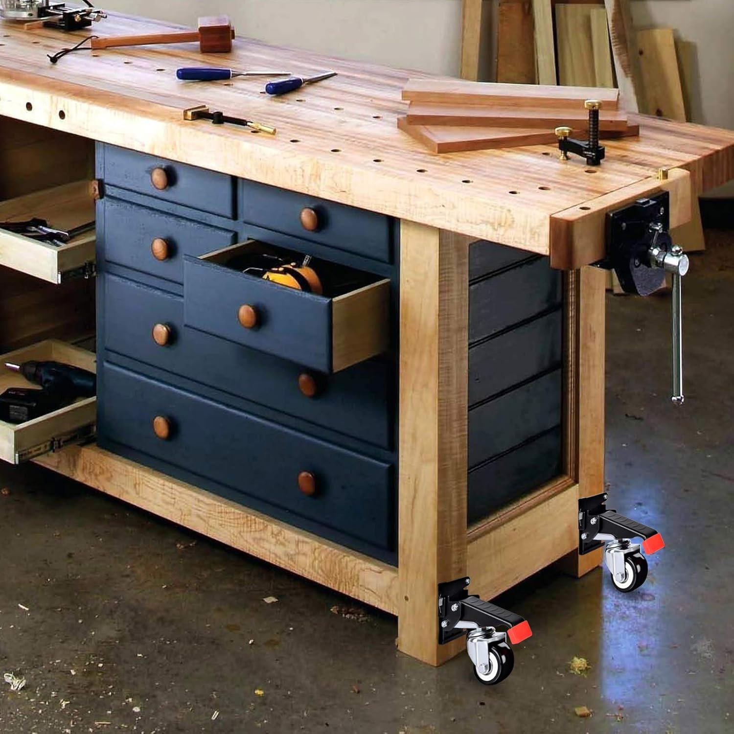 A wooden workbench with the SPACEKEEPER casters installed on its legs, showing the workbench elevated and ready for movement.