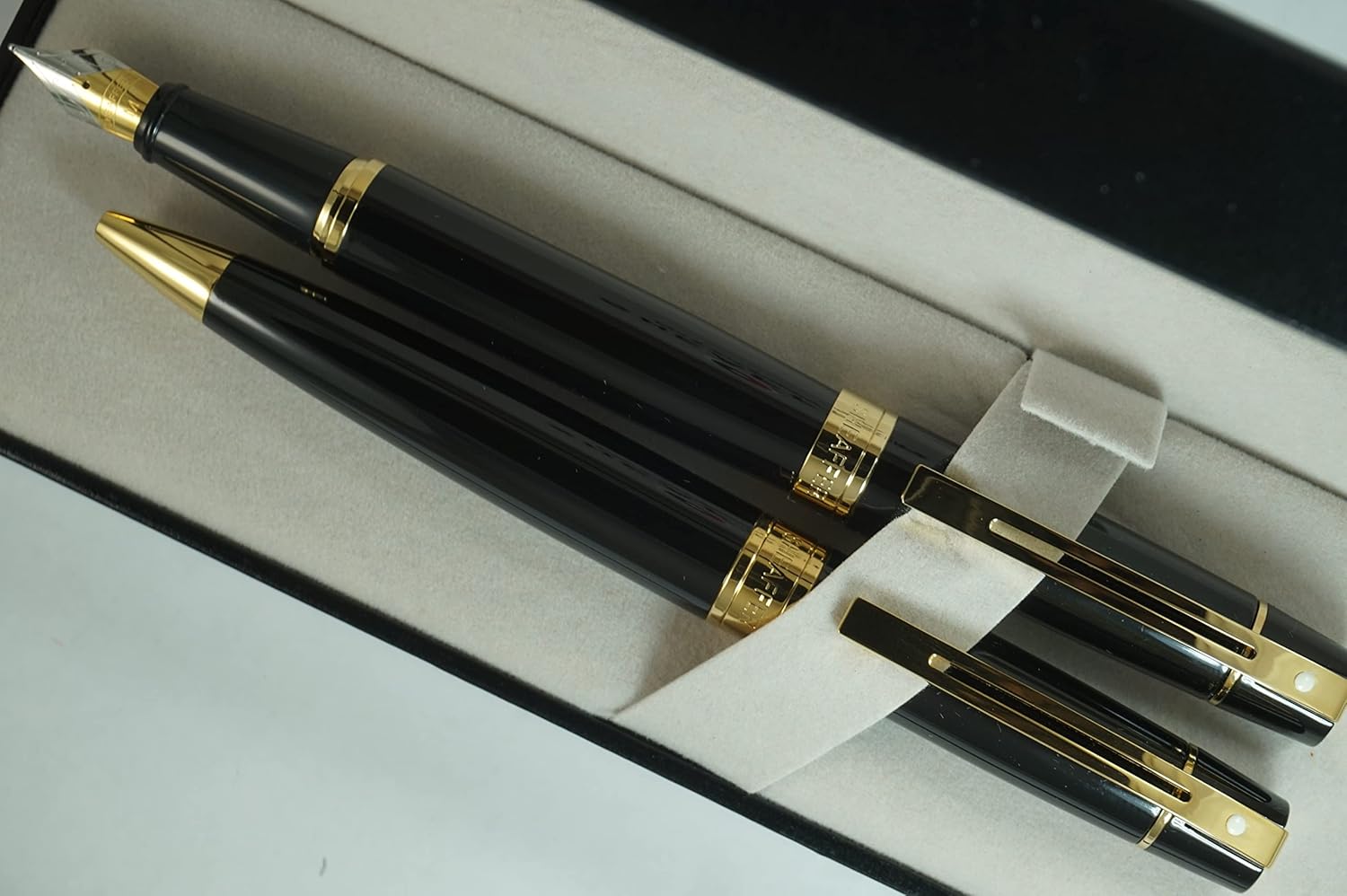 Sheaffer 300 Duo Black Lacquer and Gold Appointments Limited Series with Signature white dot of Excellence and wide band Medium Point Fountain Pen and Ballpoint Pen set.