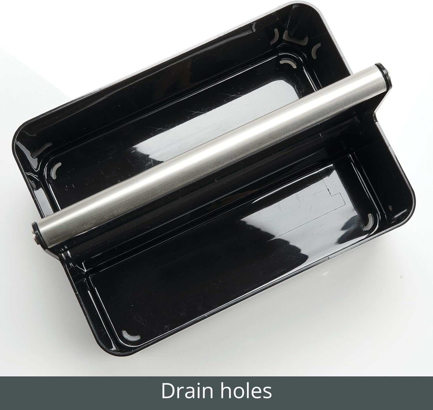 Close-up view of the bottom of the mDesign Aura Collection Plastic Shower Caddy showing drain holes