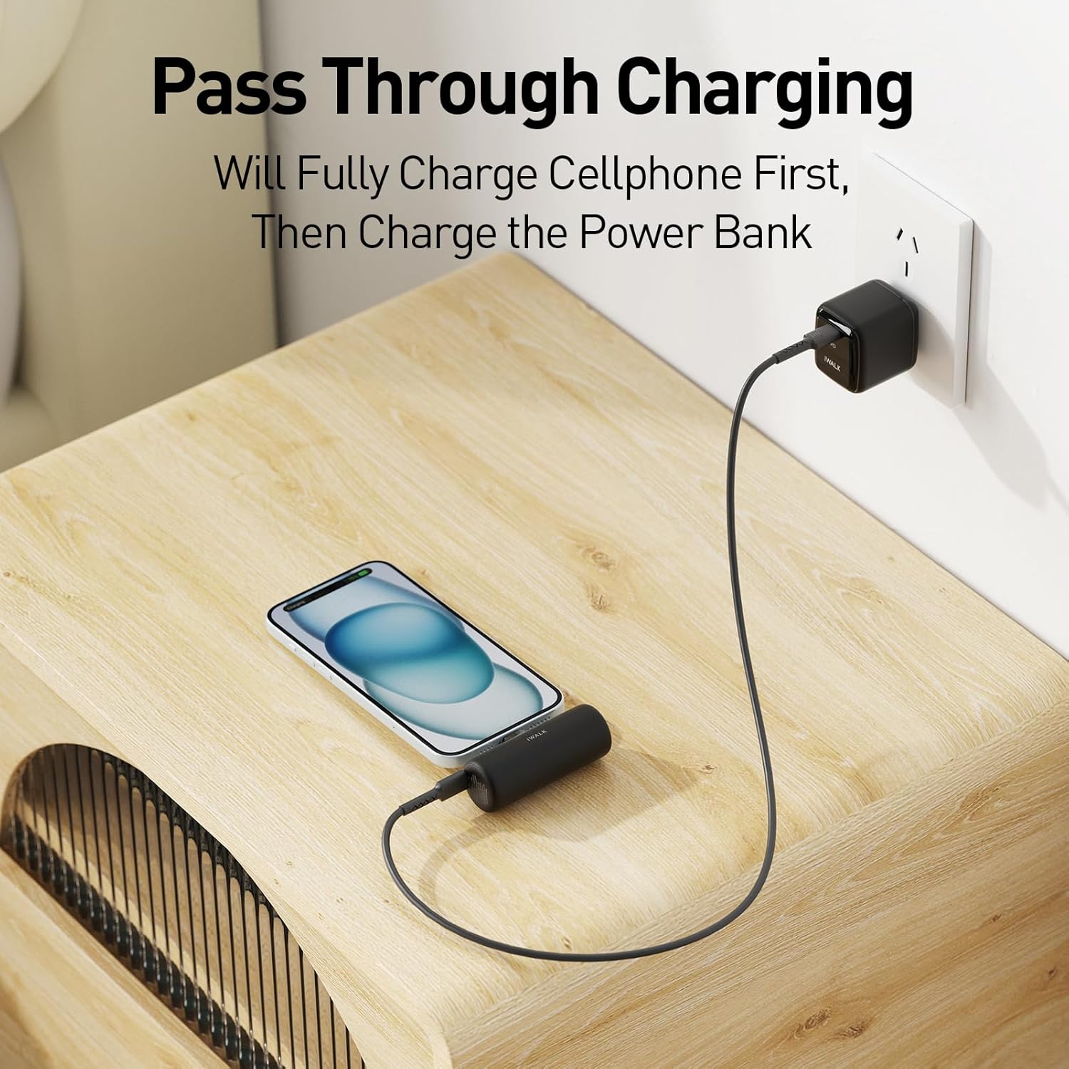 The iWALK portable charger connected to a smartphone, which is then connected to a wall charger, demonstrating pass-through charging.