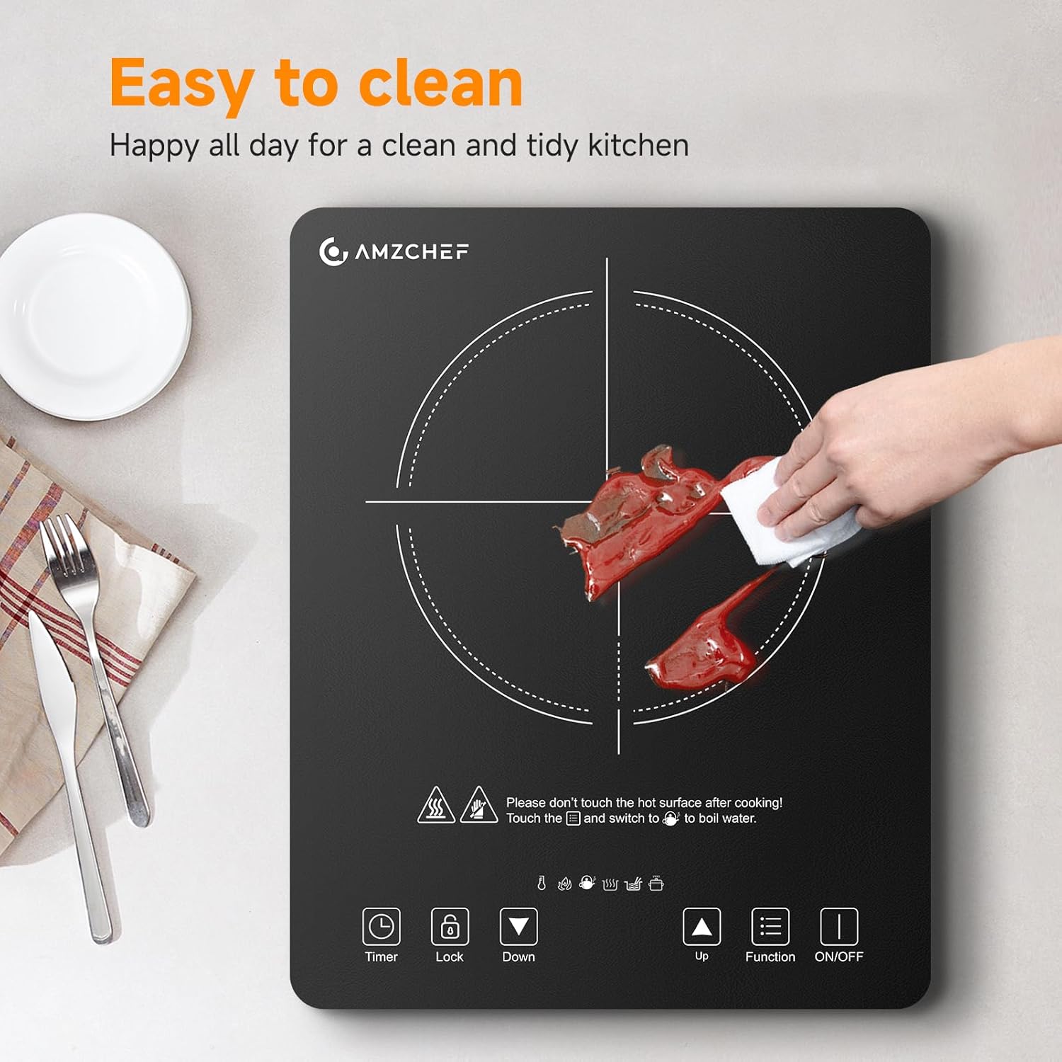 Hand wiping the AMZCHEF Induction Cooktop surface, demonstrating its easy-to-clean feature.