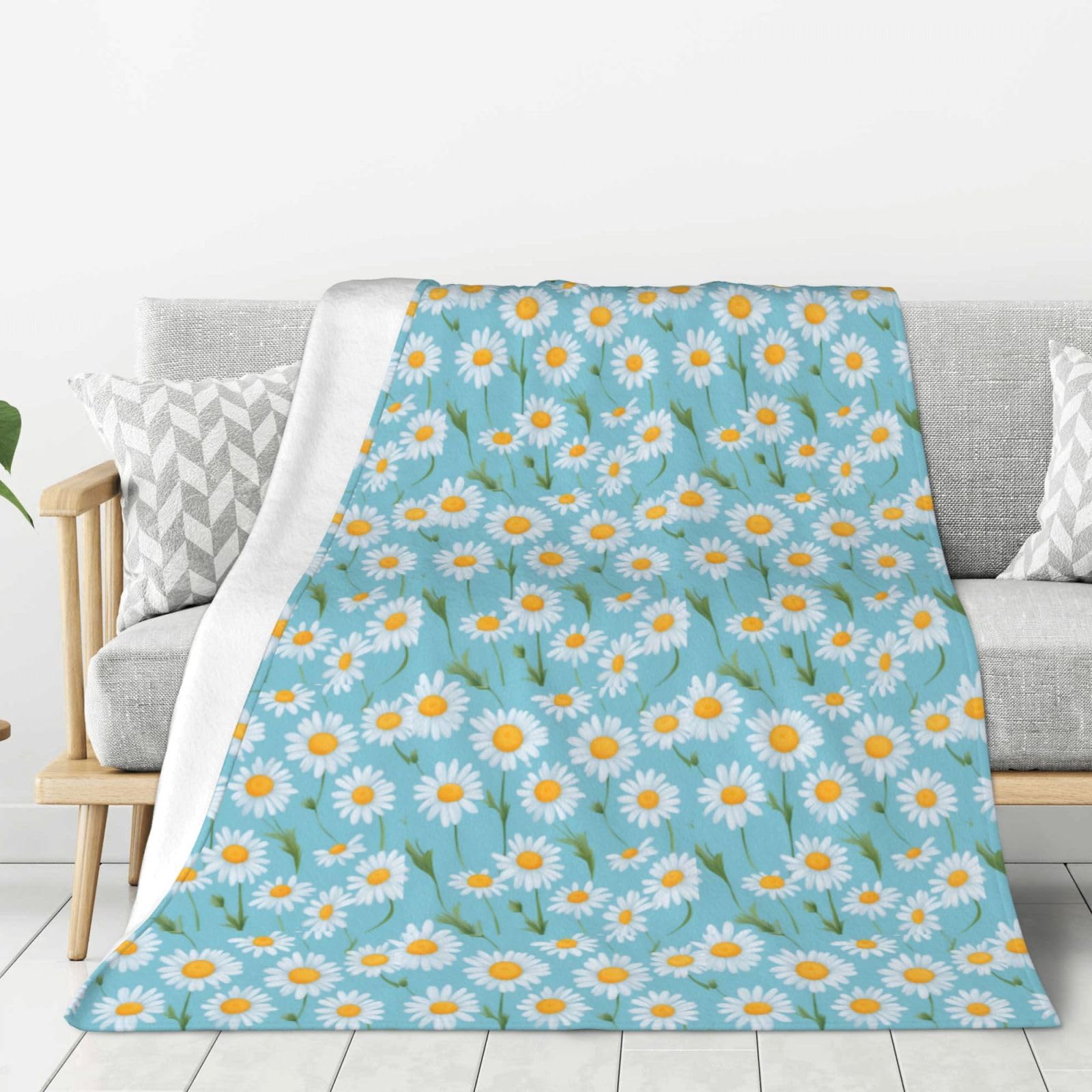 Couverture douce bleue aux marguerites pour lit et canapé douillet