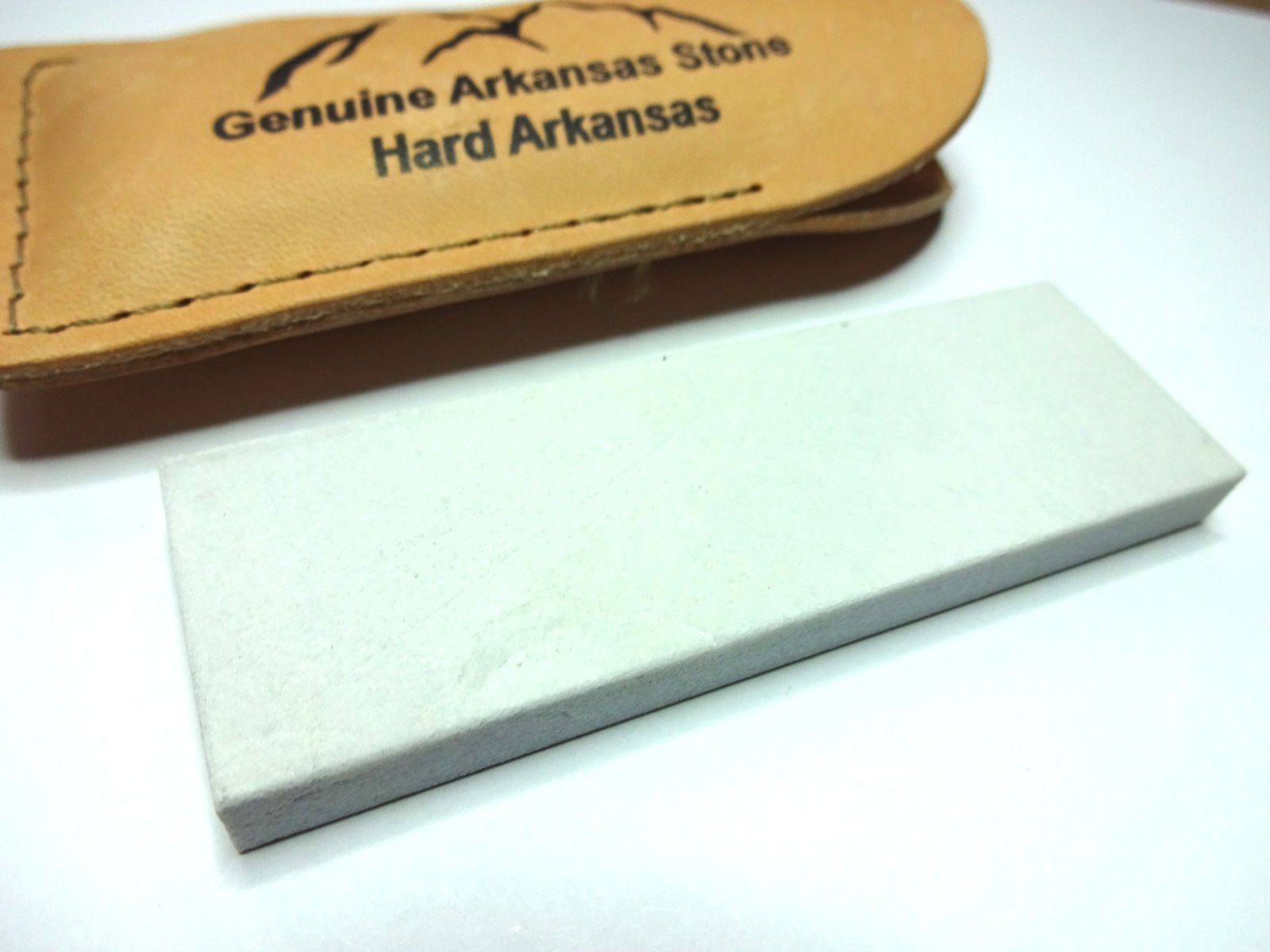 Hard Arkansas Stone Fine Sharpening Stone Used to Sharpen Tools in Leather Pouch