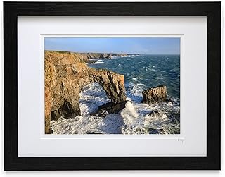Mounted or framed photograph by Andrew Ray featuring stormy seas at The Green Bridge of Wales in Pembrokeshire