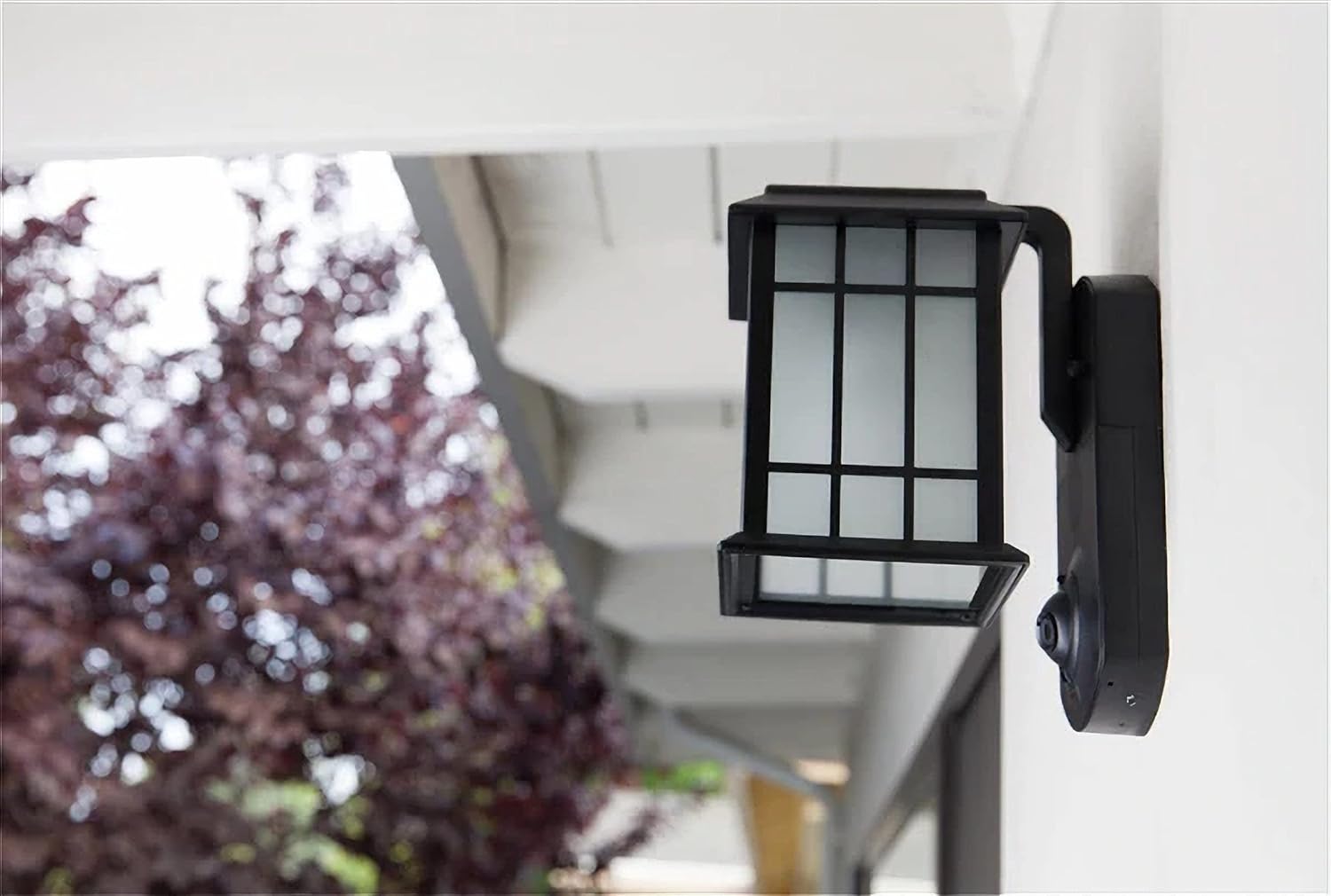 KUNA Craftsman Camera Porch Light installed on an exterior wall, viewed from the side.