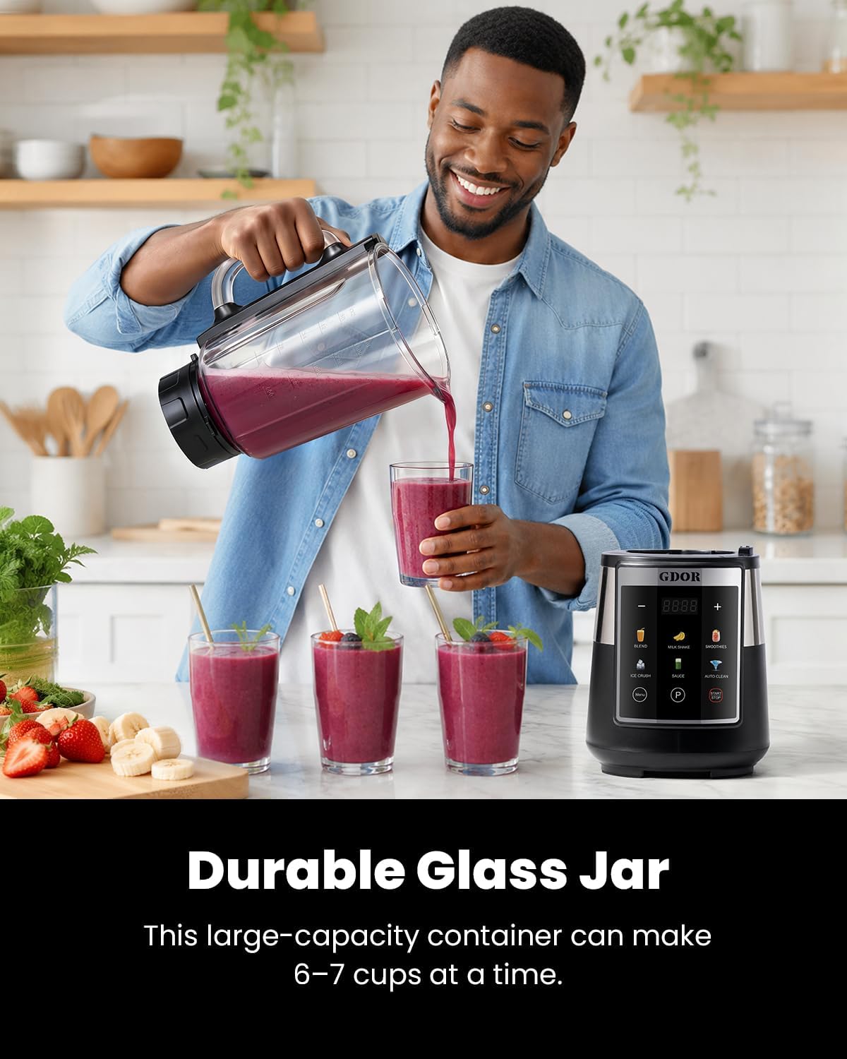 Man pouring a smoothie from the large glass jar of the GDOR blender