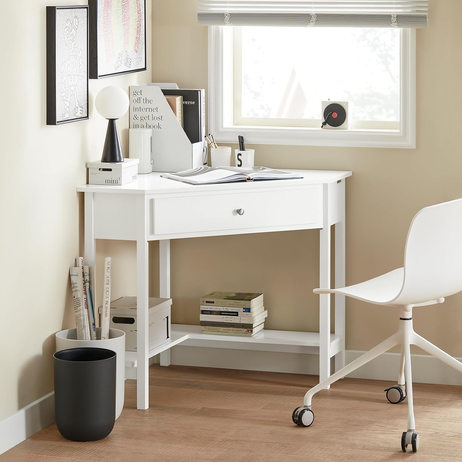 Image of the white SoBuy FWT31-W corner desk placed in a room corner, showcasing its compact and space-saving design.
