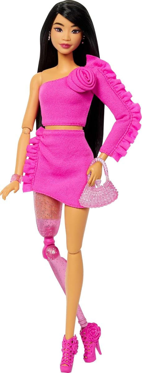 Deluxe Style Doll #2 in Barbiecore Outfit, Black Hair and Glittery Prosthetic Leg, Pink Top and Skirt Set with Rosette Detail and Accessories
